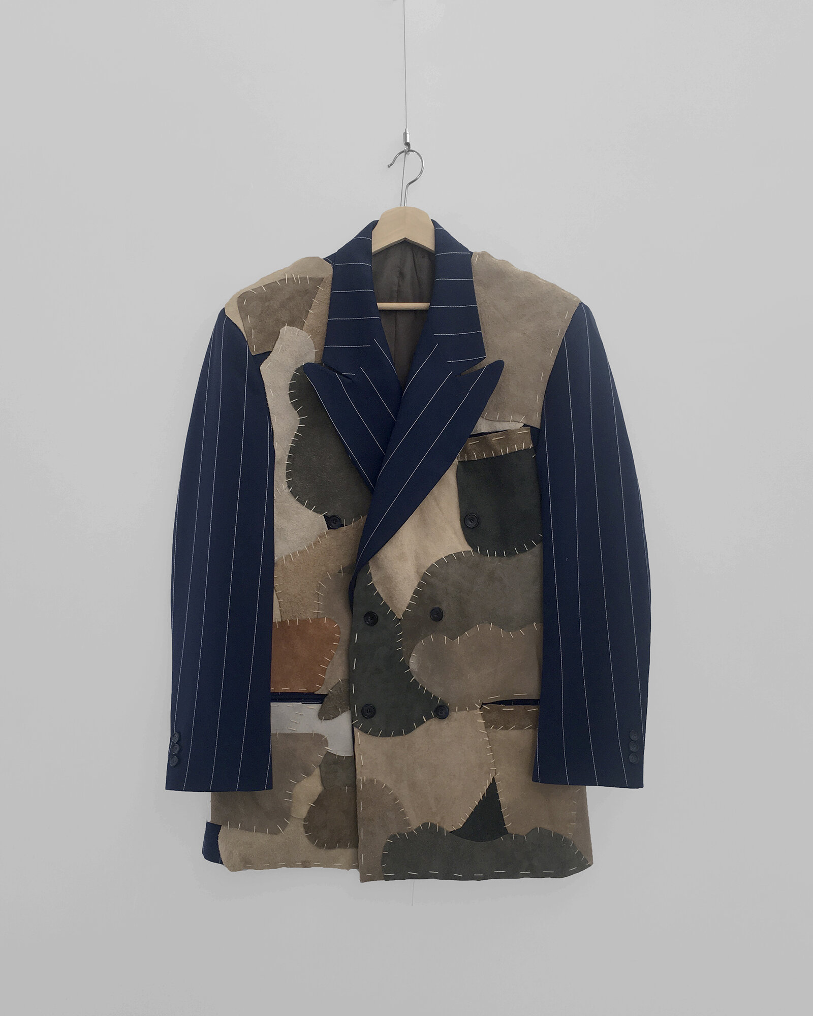  Rosalee Bernabe,&nbsp; Community Leisure Jacket,&nbsp; 2019. Suit jacket, suede, embroidery floss. 34 x 26 in. Image courtesy of the artist.&nbsp; 