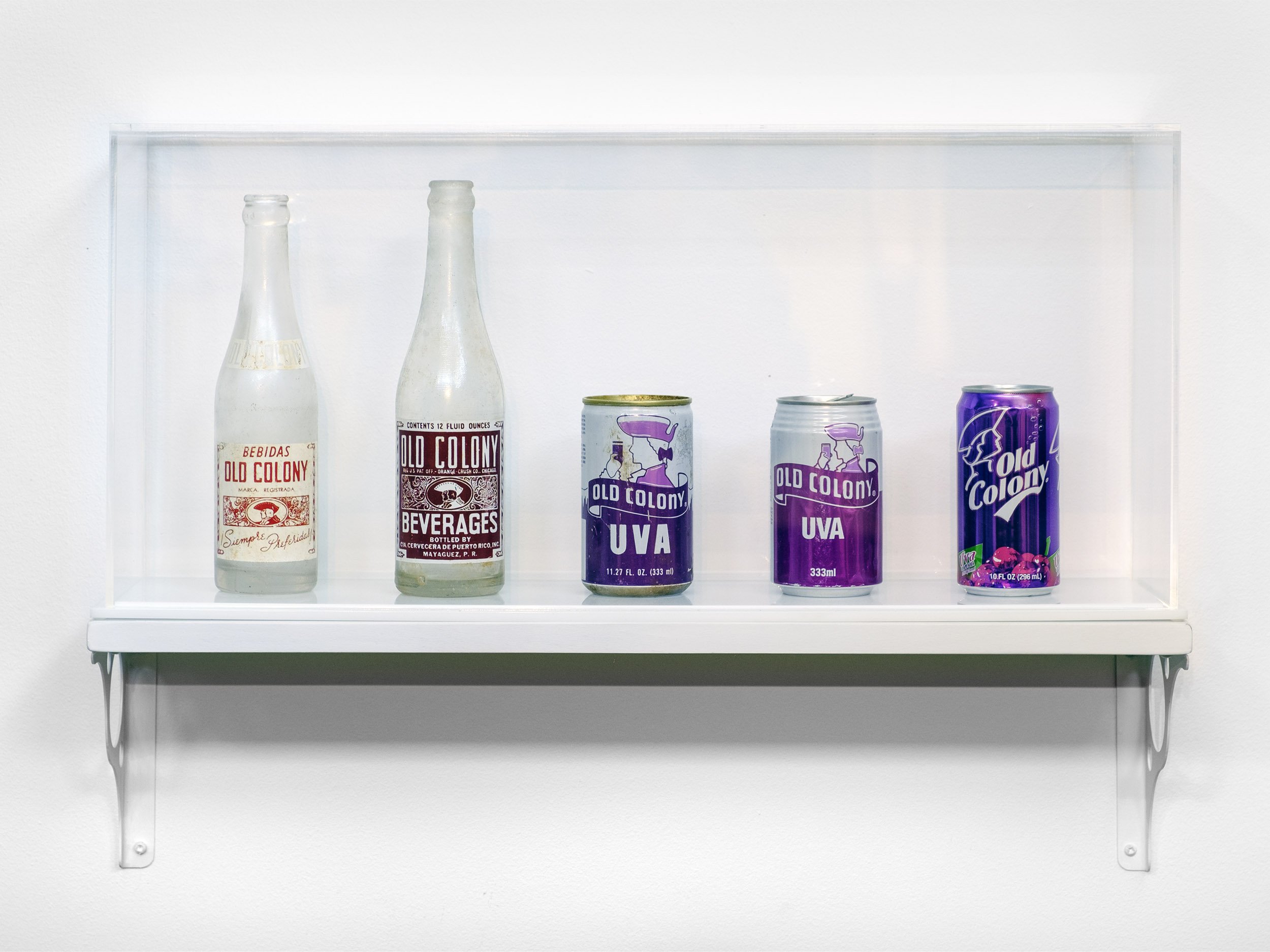  Installation view.  Old Colony Timeline . Found objects: vintage Old Colony brand bottles and cans, circa 1940s–2017 | 2018.  The Museum of the Old Colony , Duke Hall Gallery of Fine Art, 2022. 
