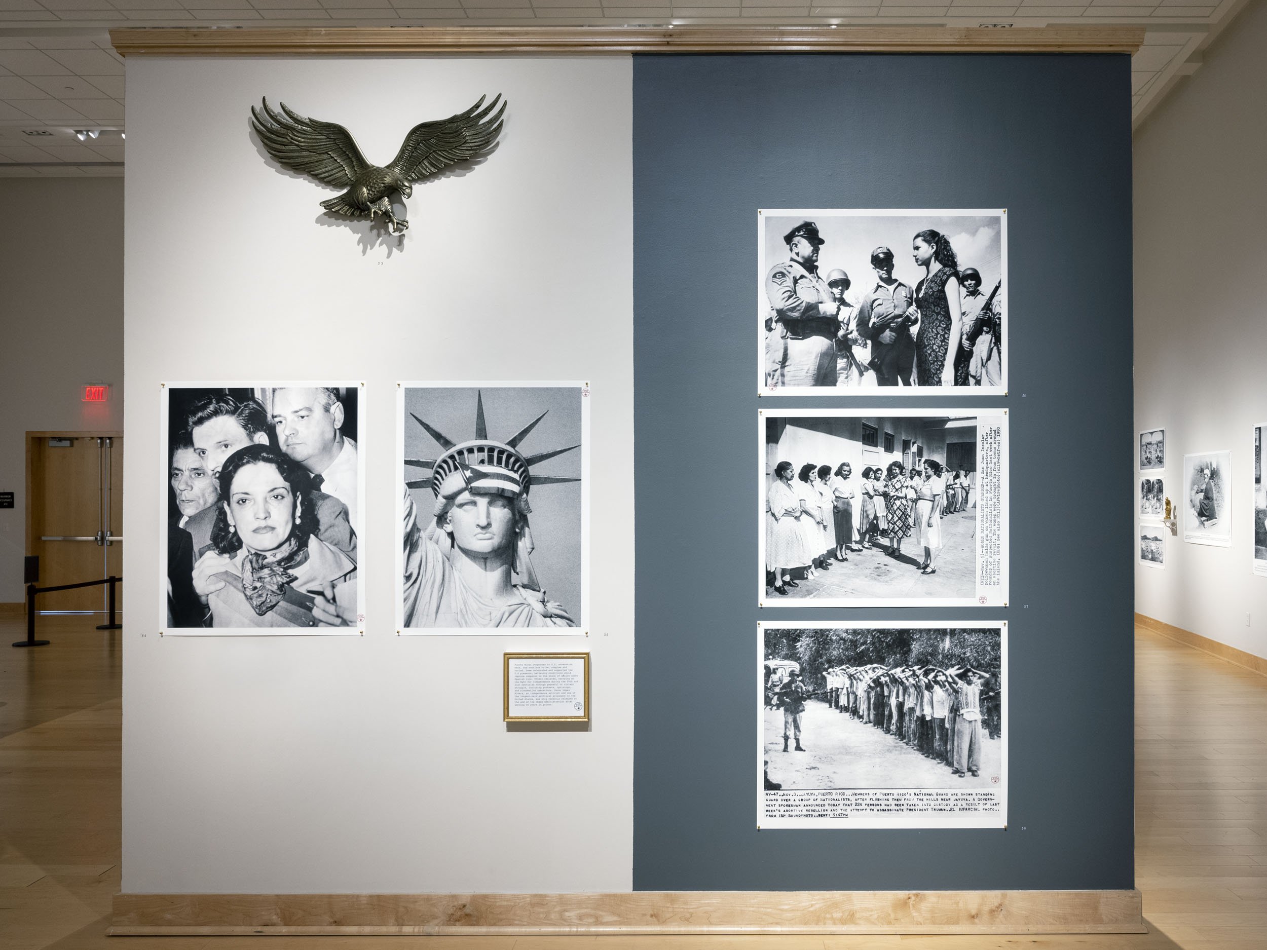  Installation view.  Watchful Eagle ,  Lolita Lebrón Arrested ,  Statue of Liberty with Puerto Rican Flag in 1977 ,   and Puerto Rican Nationalist-related photographs and captions from 1950 | 2019-2021.  The Museum of the Old Colony , Duke Hall Galle