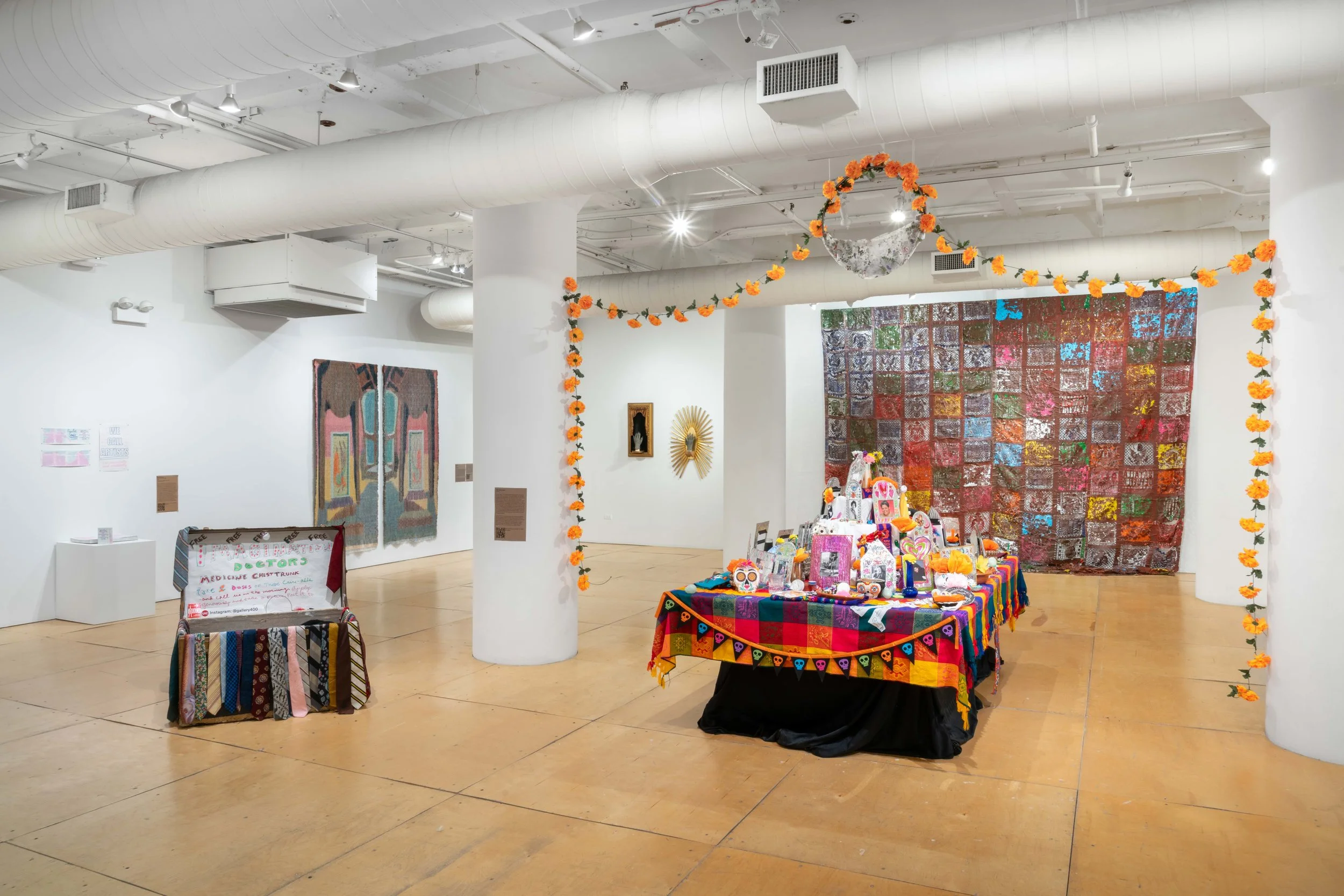 an altar surrounded y papel pi ado and a trunk full of ties