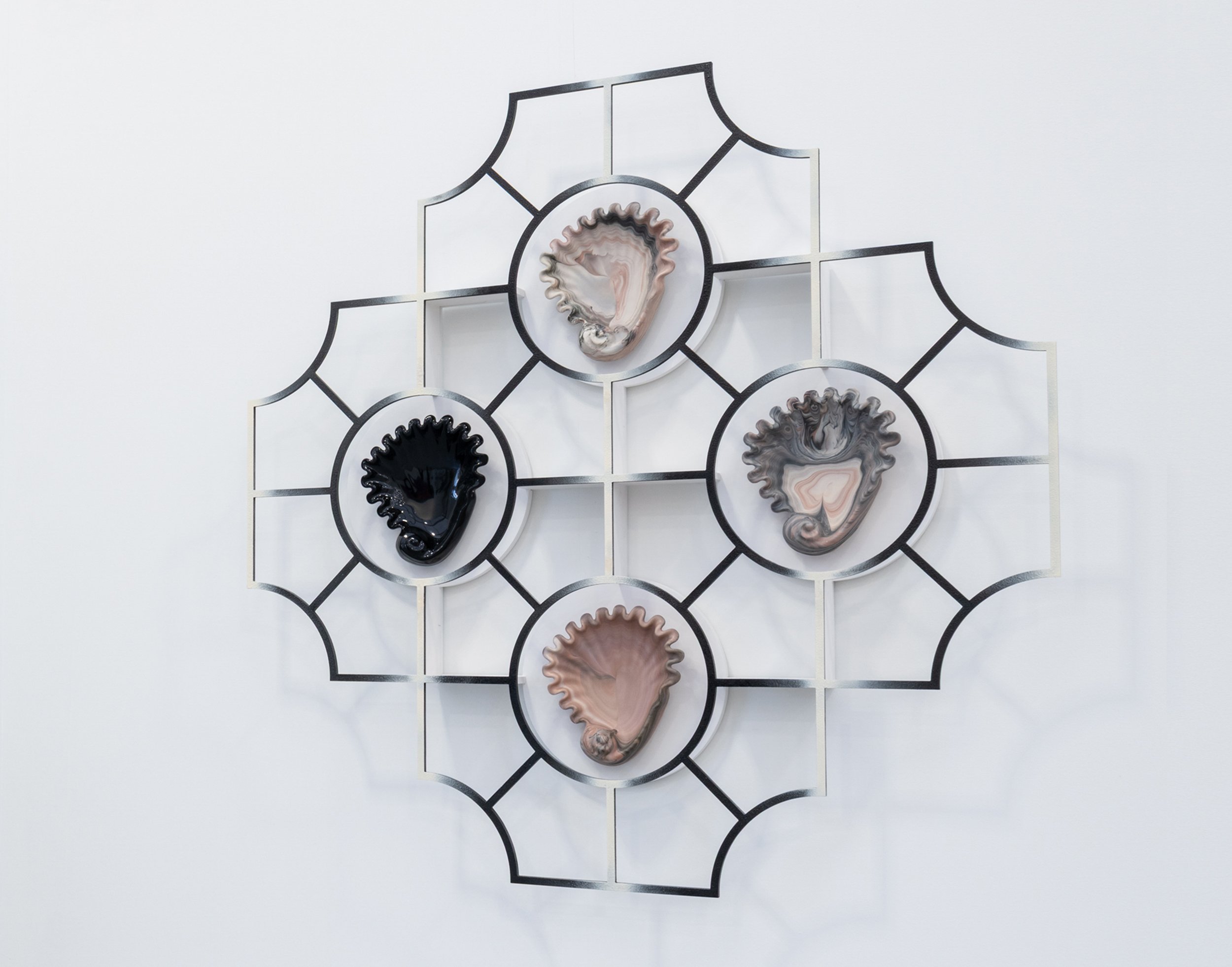 geometric shapes featuring four seashell like shapes