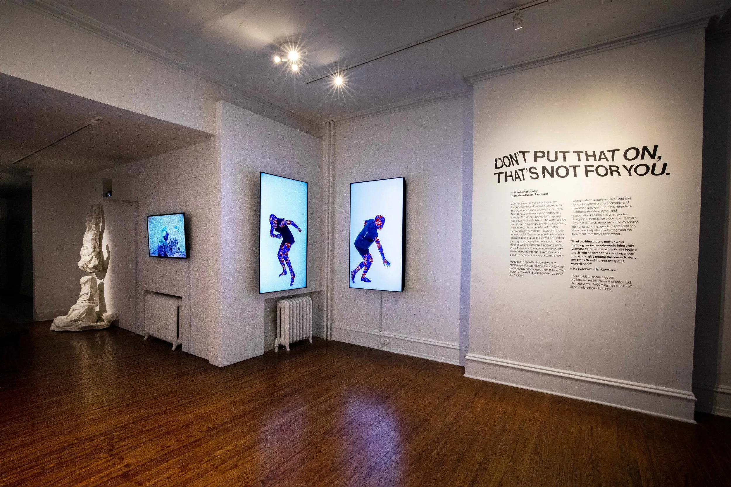 photo of exhibition with a wall that reads "don't put that on that's not for you"