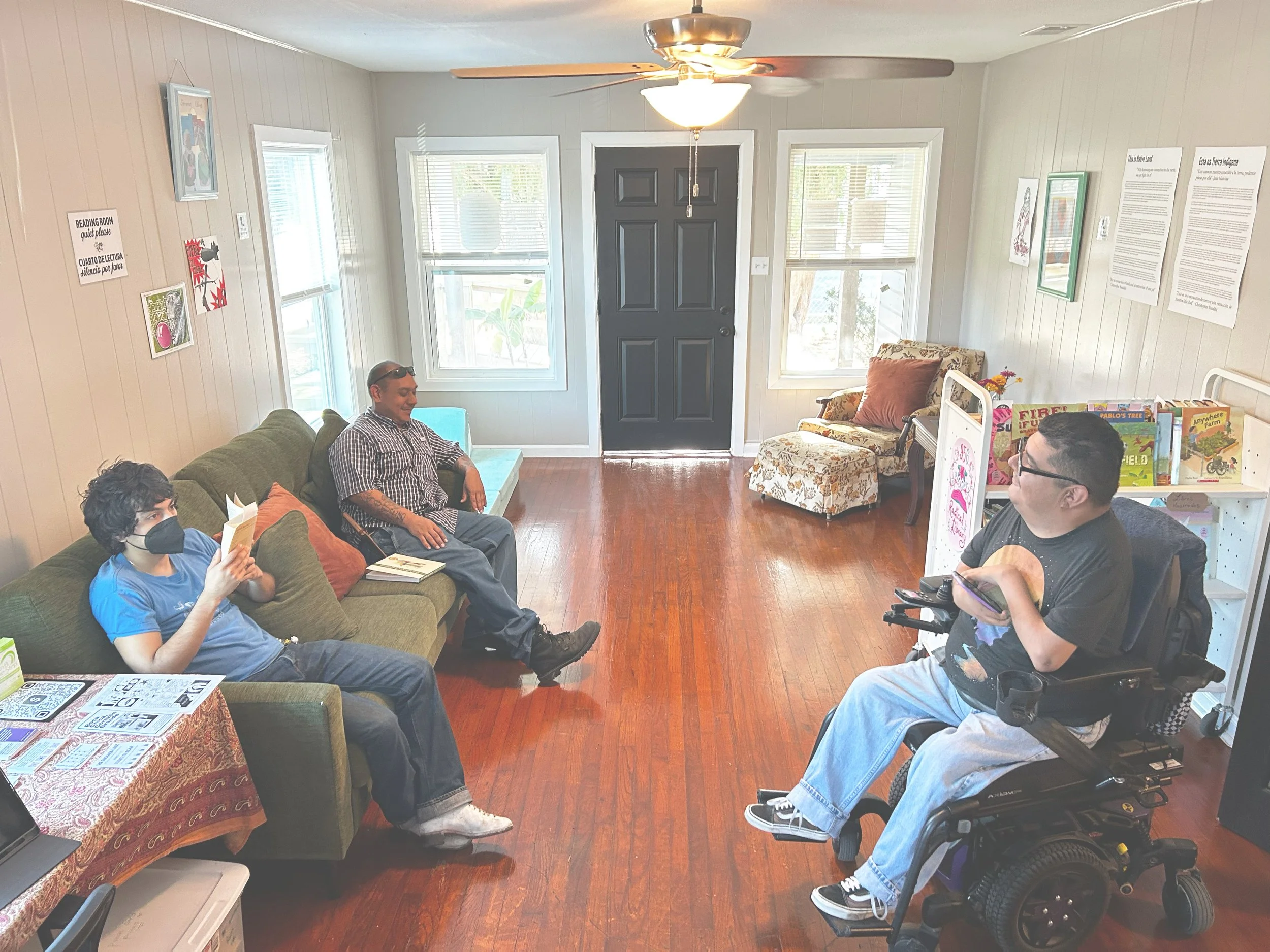 three people gathered at 956 radical library's readingroom.jpg