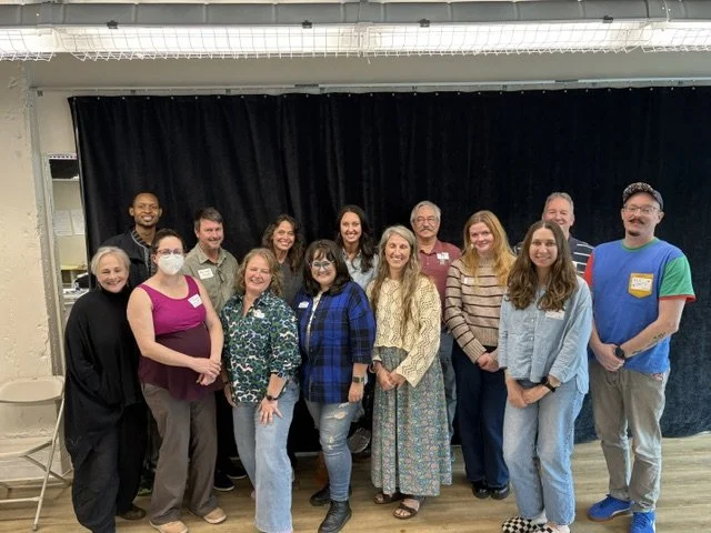15 arts leaders from across NC gather and smile for the camera