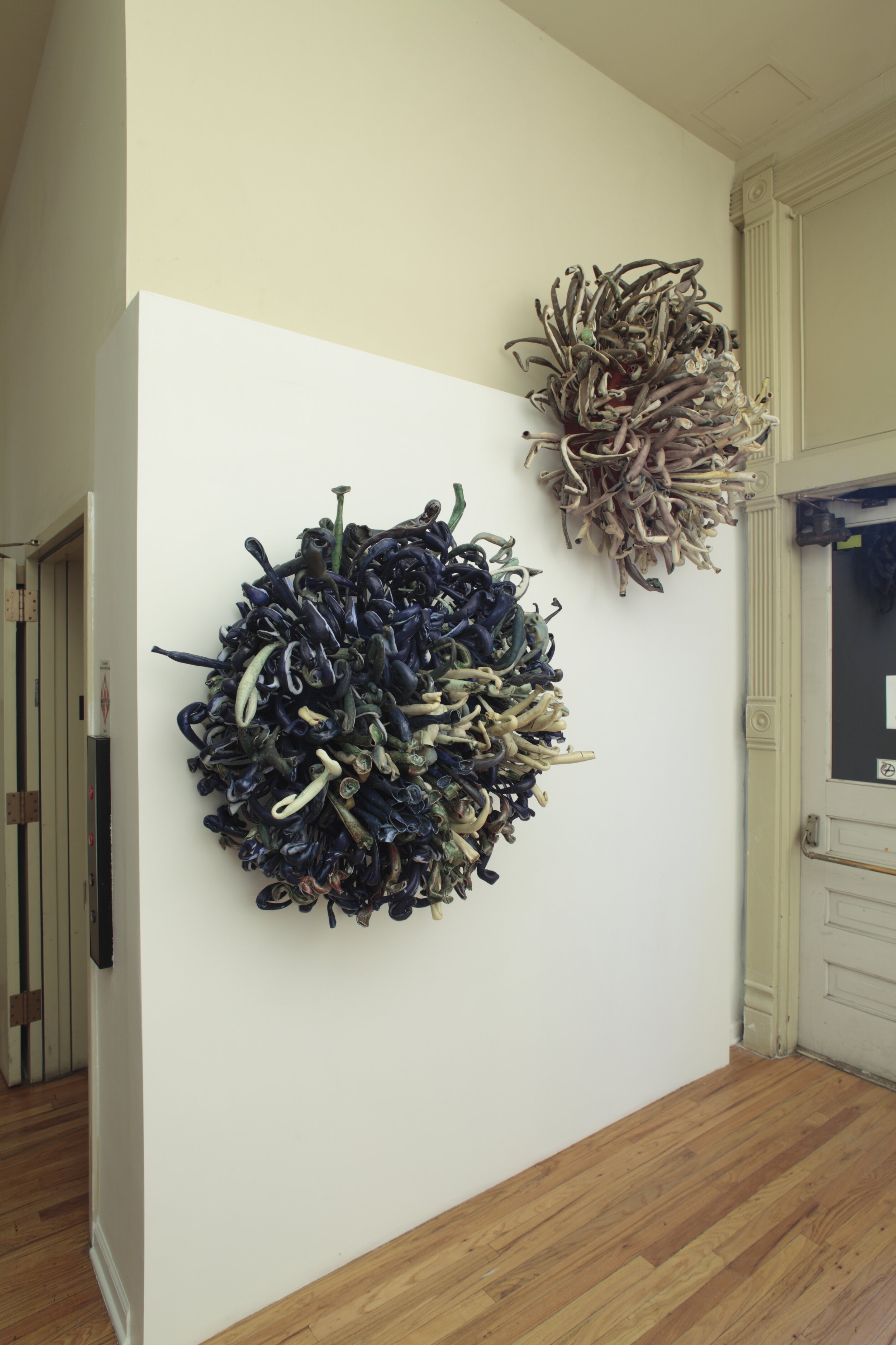   nomos (dots)   2010  47 x 47 x 15 inches  porcelain, paper, pigment, pegboard, EPS, wood    