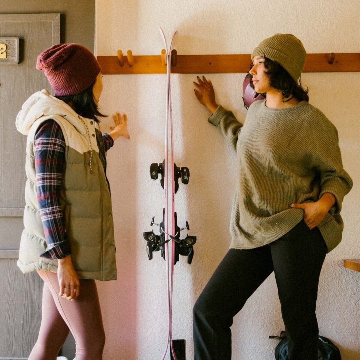 Two girls with snow skis