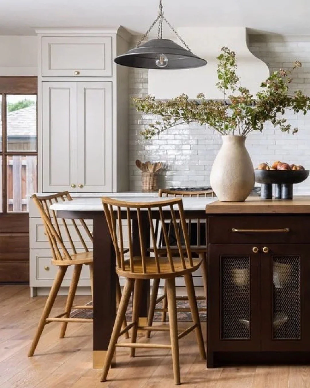 This kitchen is proof that good design doesn&rsquo;t always mean more space &mdash; sometimes it&rsquo;s just smarter space. 

We reworked the layout to add flow and warmth: a new garden door, an archway to the dining room, and a mix of marble and wo