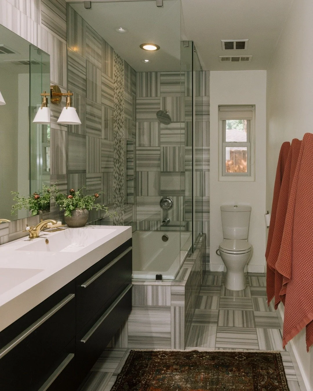 This bathroom ended up being one of those spaces that quietly surprises you. At first glance it feels simple, but the longer you stand in it, the more the details start to speak. ✨

The soft pattern, warm brass, and clean lines work together in a way