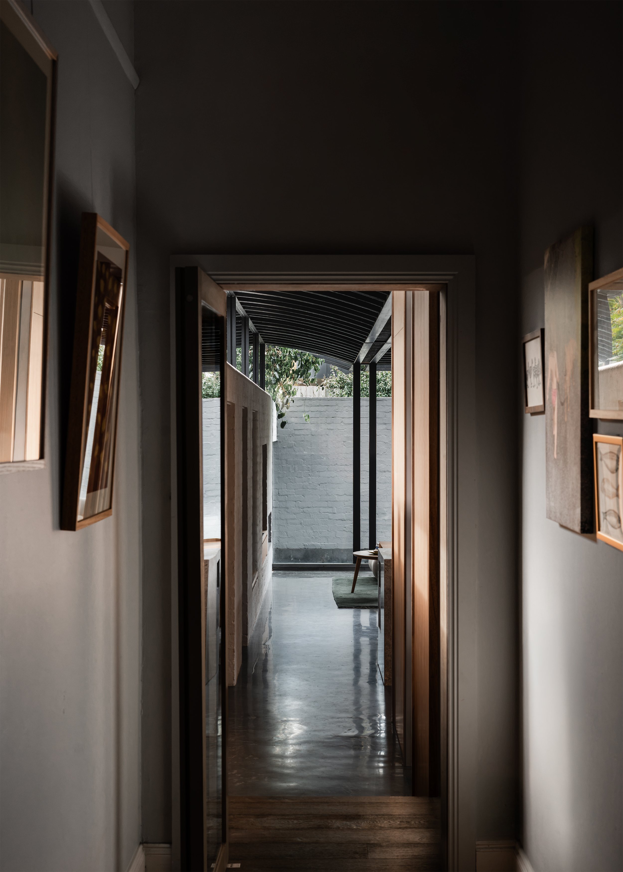 View from the existing Victorian hallway into the contemporary rear addition and walled garden.