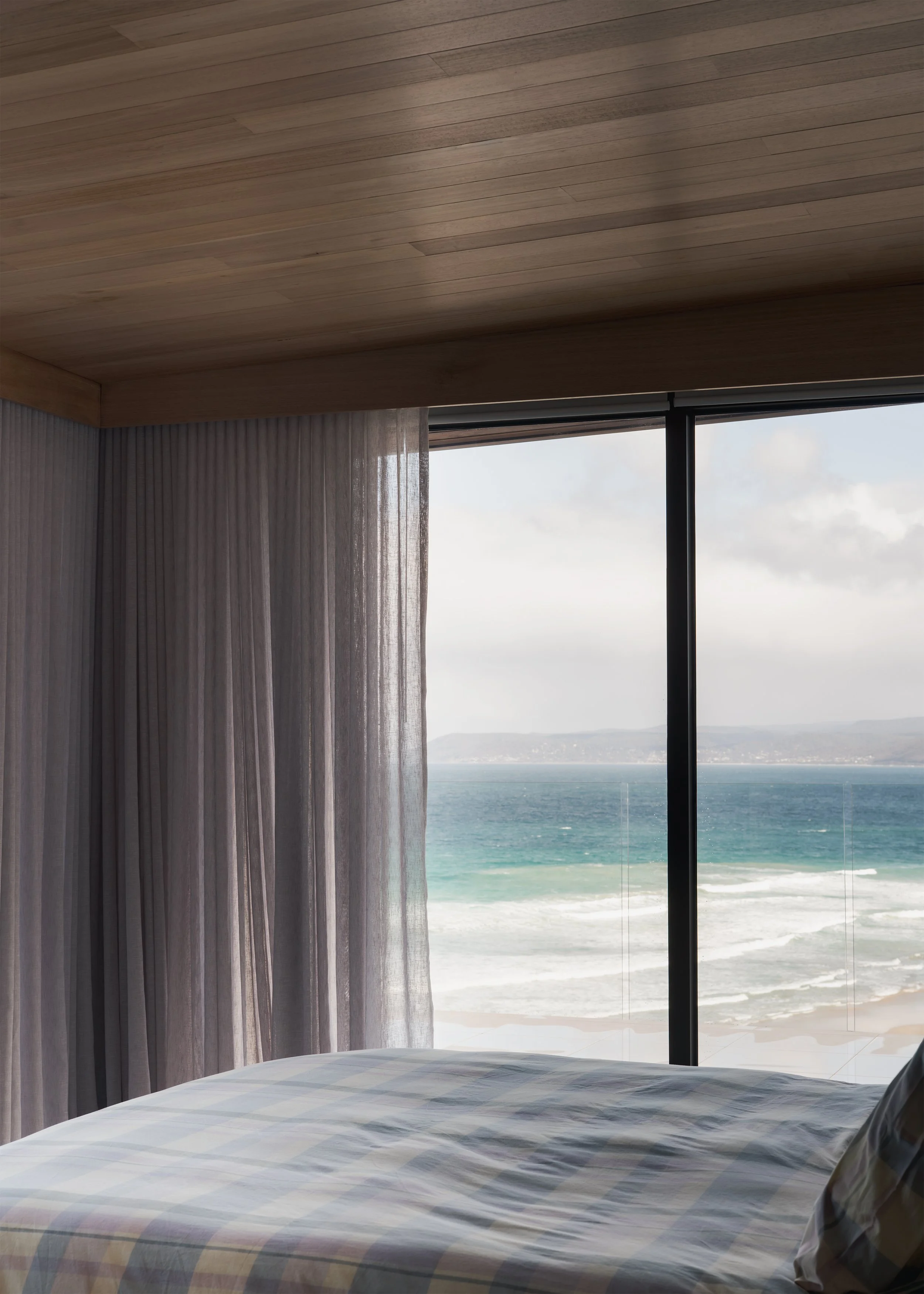 bedroom with ocean view – coastal home interior design – Fairhaven Victoria Australia – Fairhaven by LTD Architectural Design Studio and DOOD Studio – Simple Dwelling