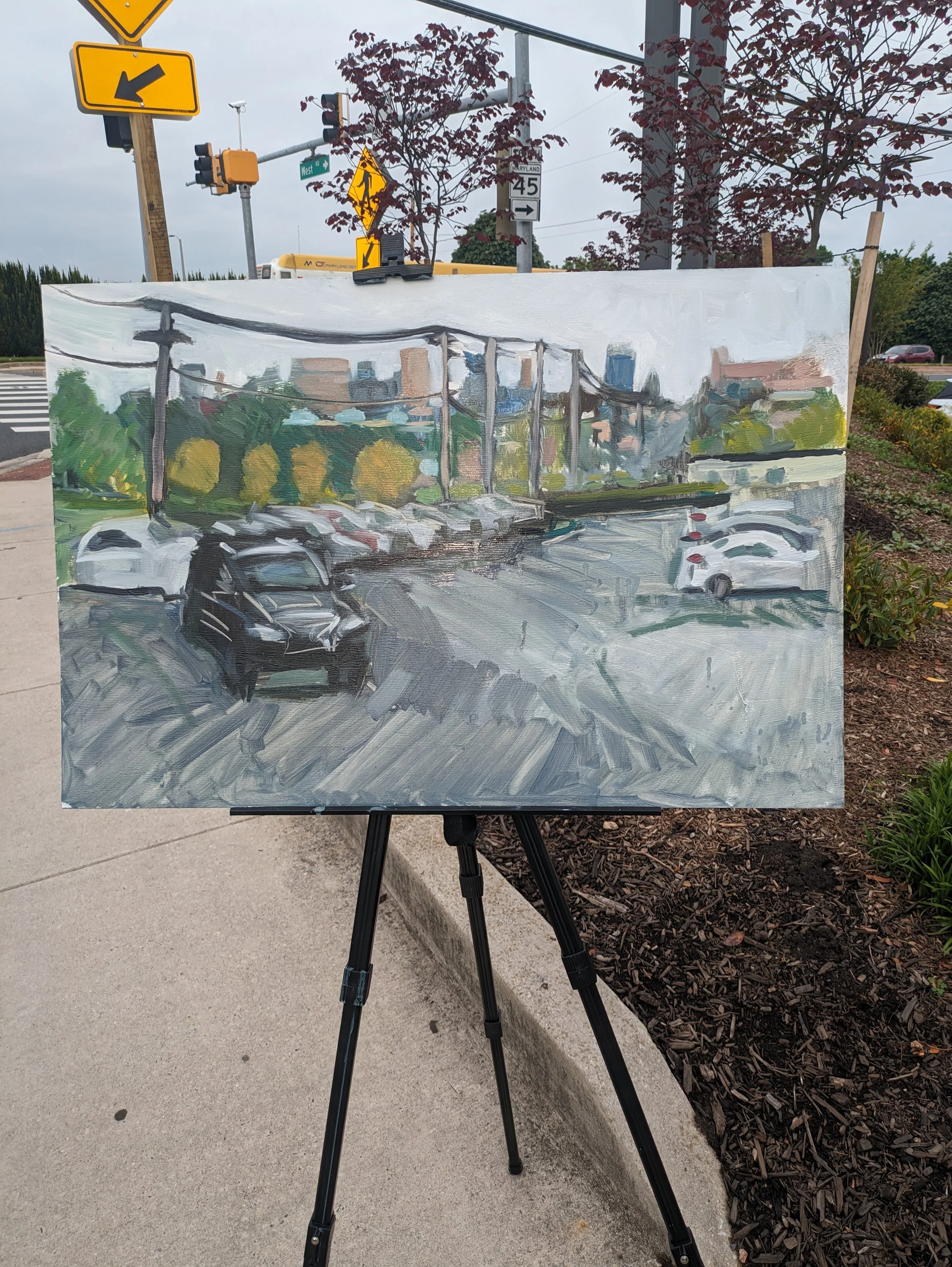 Man paints oil painting at the corner of York Road and West Road in Towson Maryland MD artist Lexus