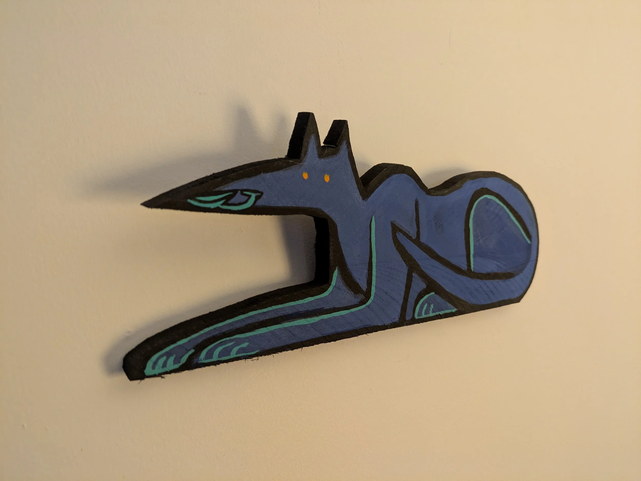 Artist Collin Cessna paints wood Anubis hand made painting casein paint recycled reclaimed wood art