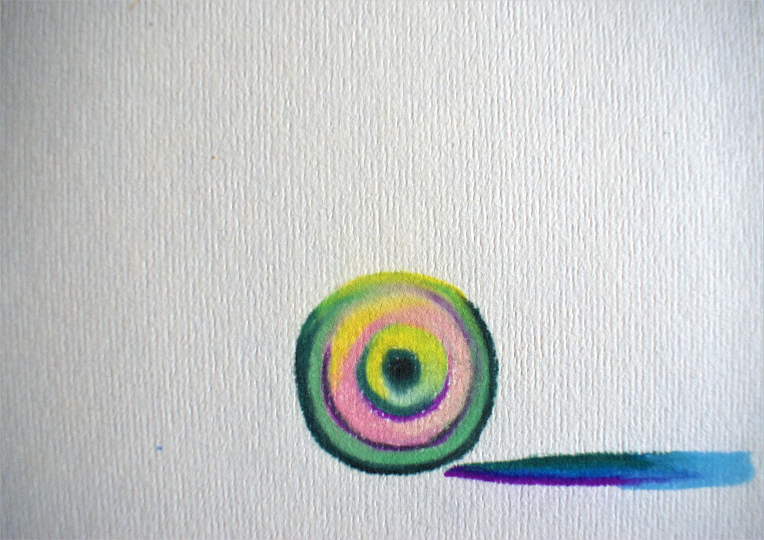 Watercolor painting of a multicolored concentric circle pattern with a shadow extending to the right.
