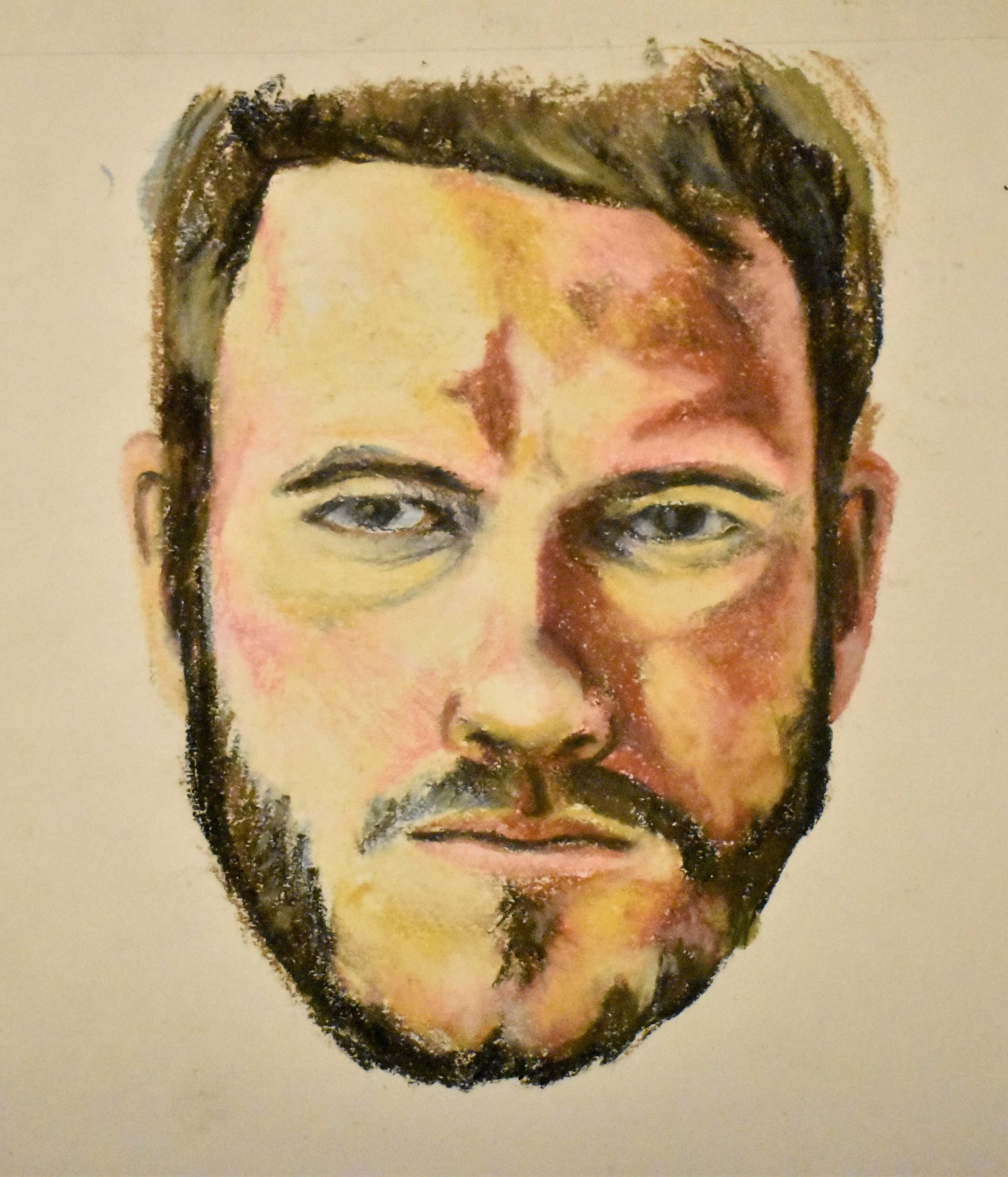 A watercolor portrait of a man with a beard and dark hair, showing detailed facial features and expressive eyes.