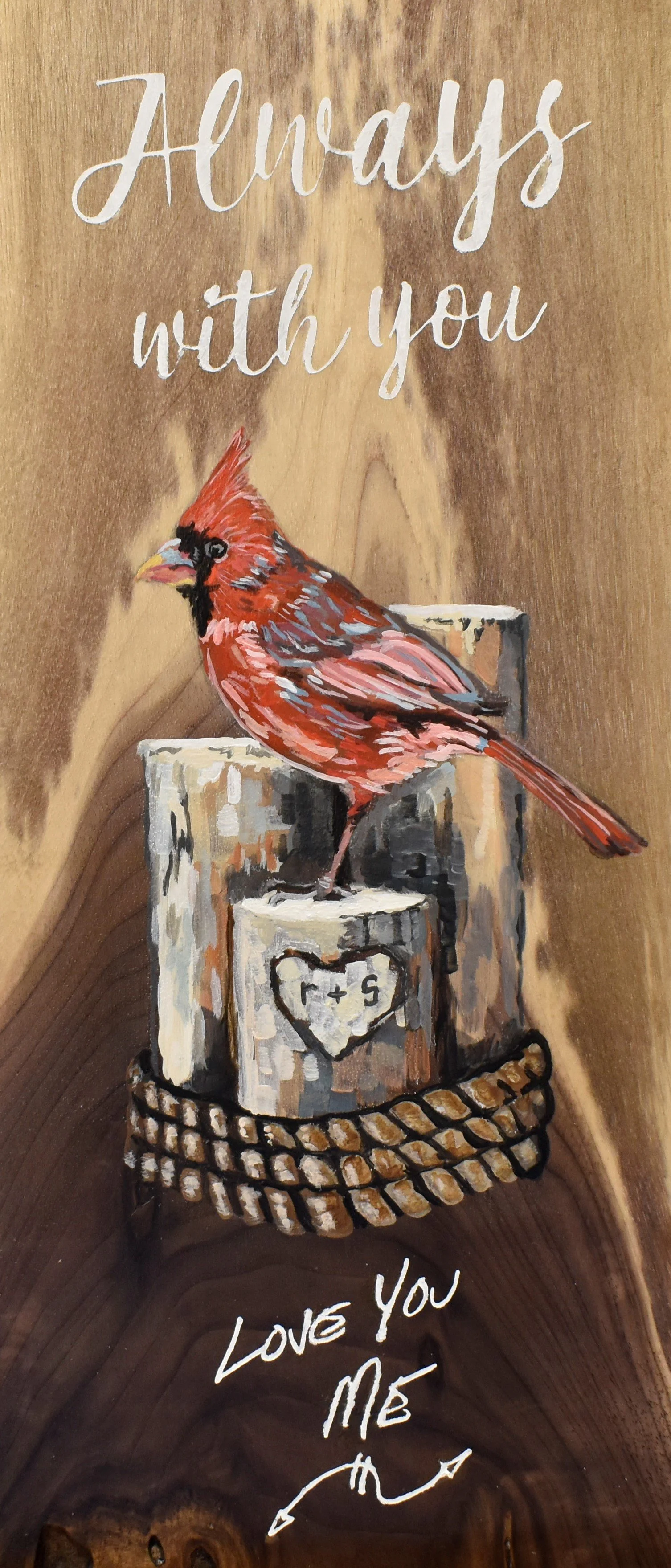 Wooden wall art with the message 'Always with you' at the top and 'Love you me' at the bottom, featuring a painted cardinal bird sitting on a log with a heart and math equation '1 + 5' inside the heart.