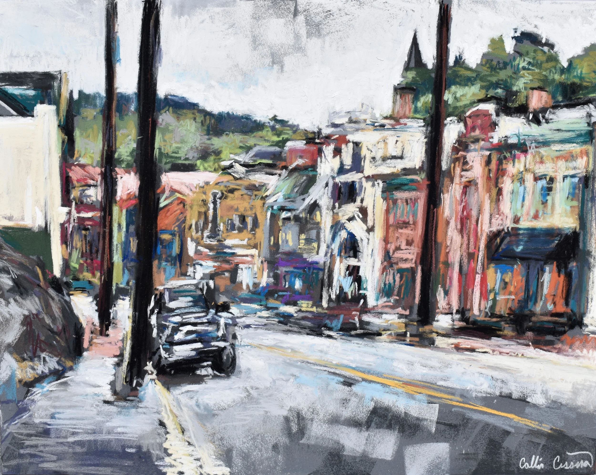 Painted street scene of a hillside neighborhood with colorful buildings, parked cars, and utility poles, with mountains in the background.