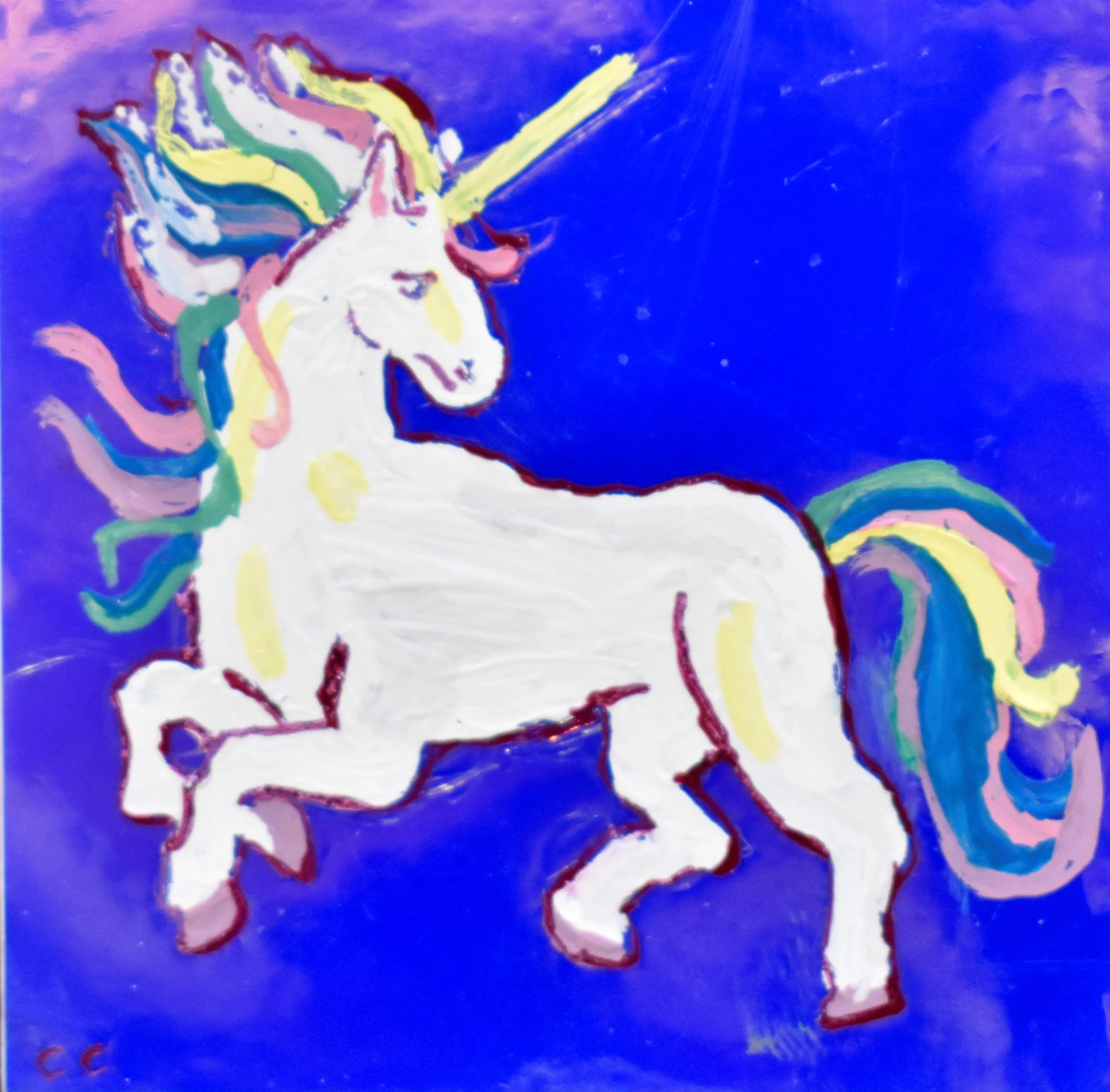 A colorful painting of a white unicorn with a rainbow mane and tail, set against a purple background. The unicorn appears to be rearing up with a closed eyes expression and a straight horn.