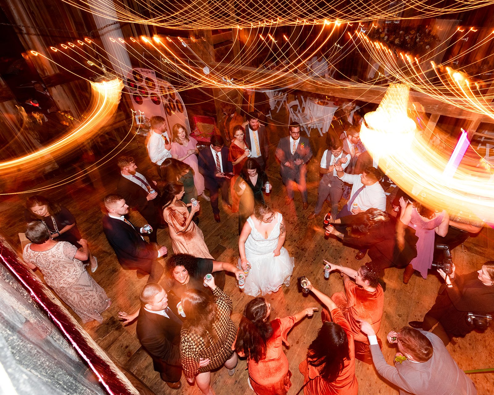 KirstenChris-long-exposure-dancing-wedding-reception-barn.jpg