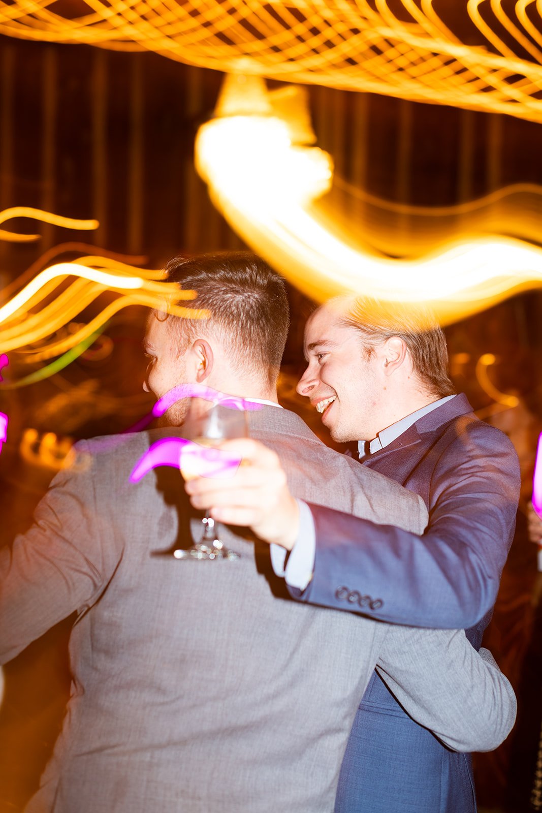 KirstenChris-wedding-reception-guests-dancing-light-trails-long-exposure.jpg