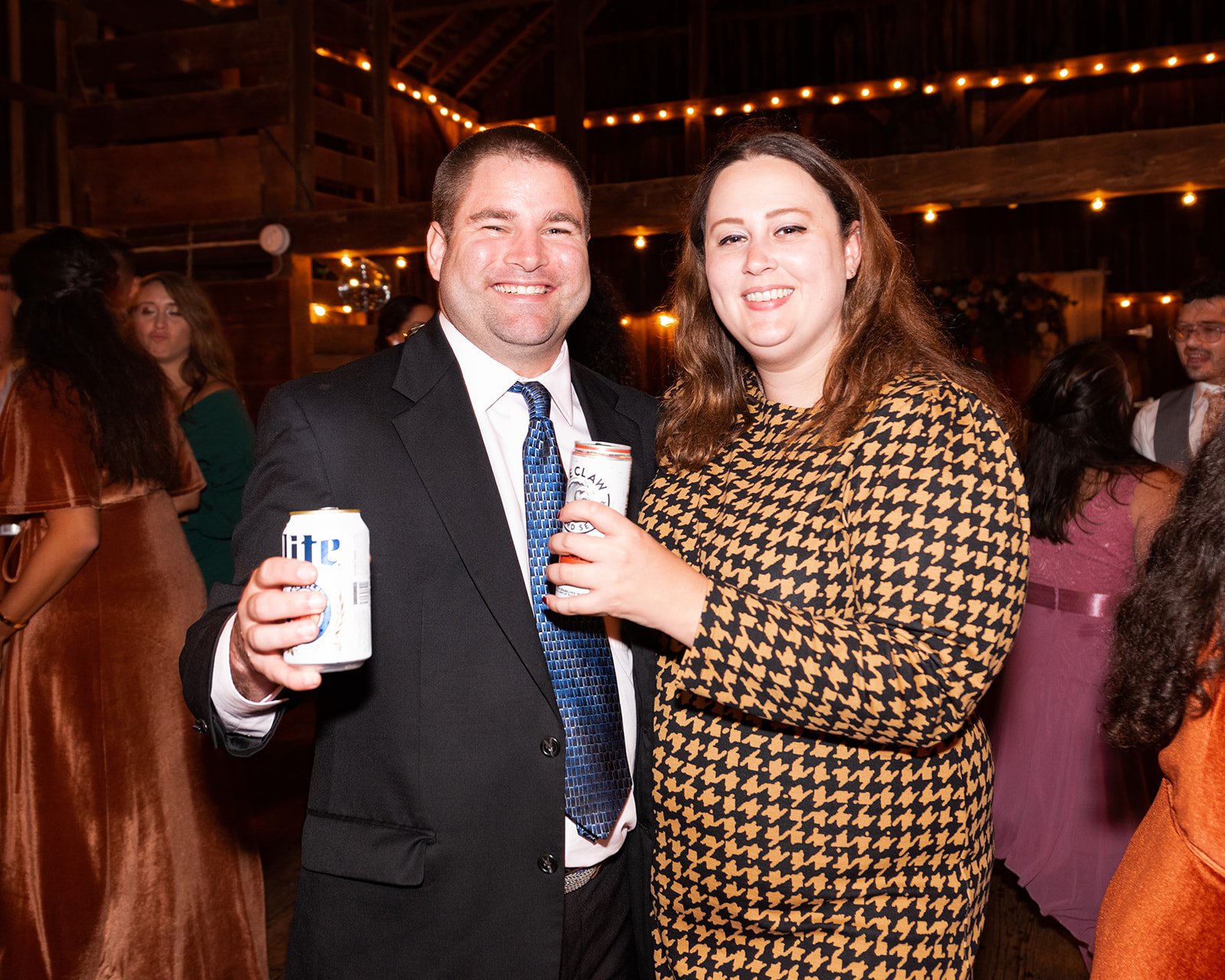 KirstenChris-silverbrook-farm-barn-wedding-reception-guests-smiling.jpg
