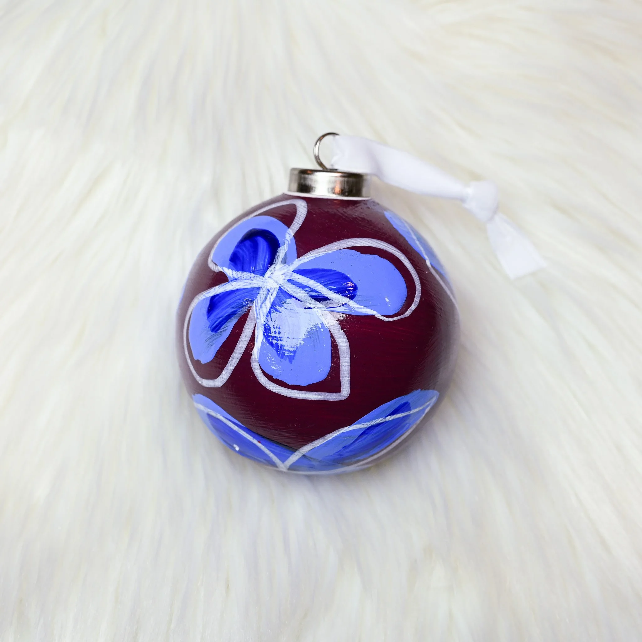 BLUE FLOWERS ON BURGUNDY