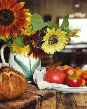 Flowers, bread, fresh tomatoes