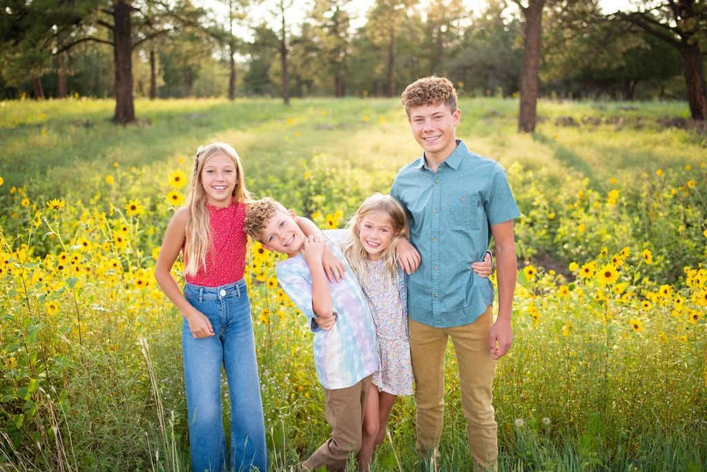 Kids acting silly smiling at the camera during Flagstaff family photography session