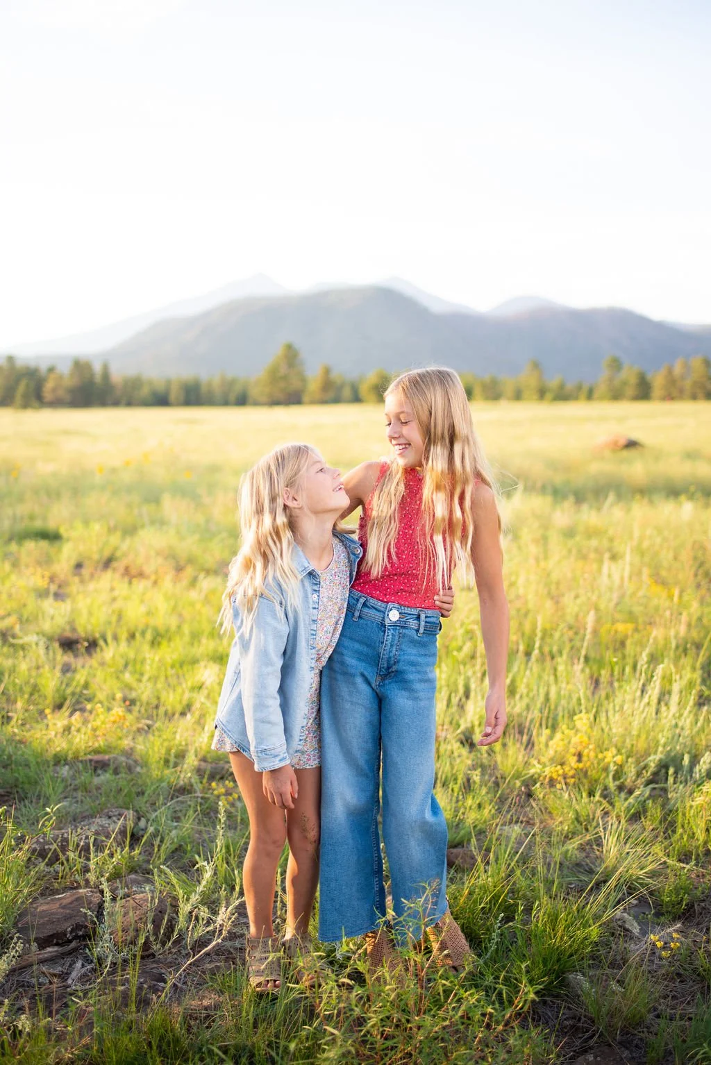 Daughters hugging during Flagstaff family photography session