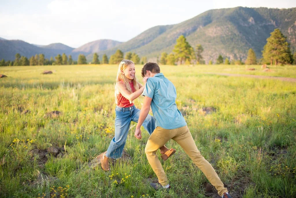Siblings wrestling during Flagstaff family photography session
