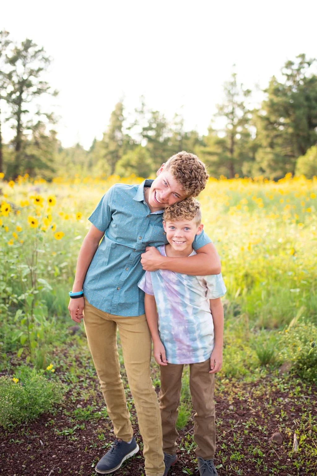 Two sons hugging during Flagstaff family photography session