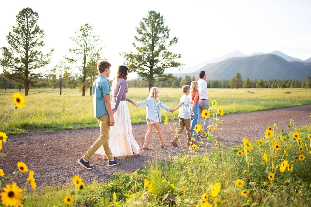 Family walking holding hands during Flagstaff family photography session