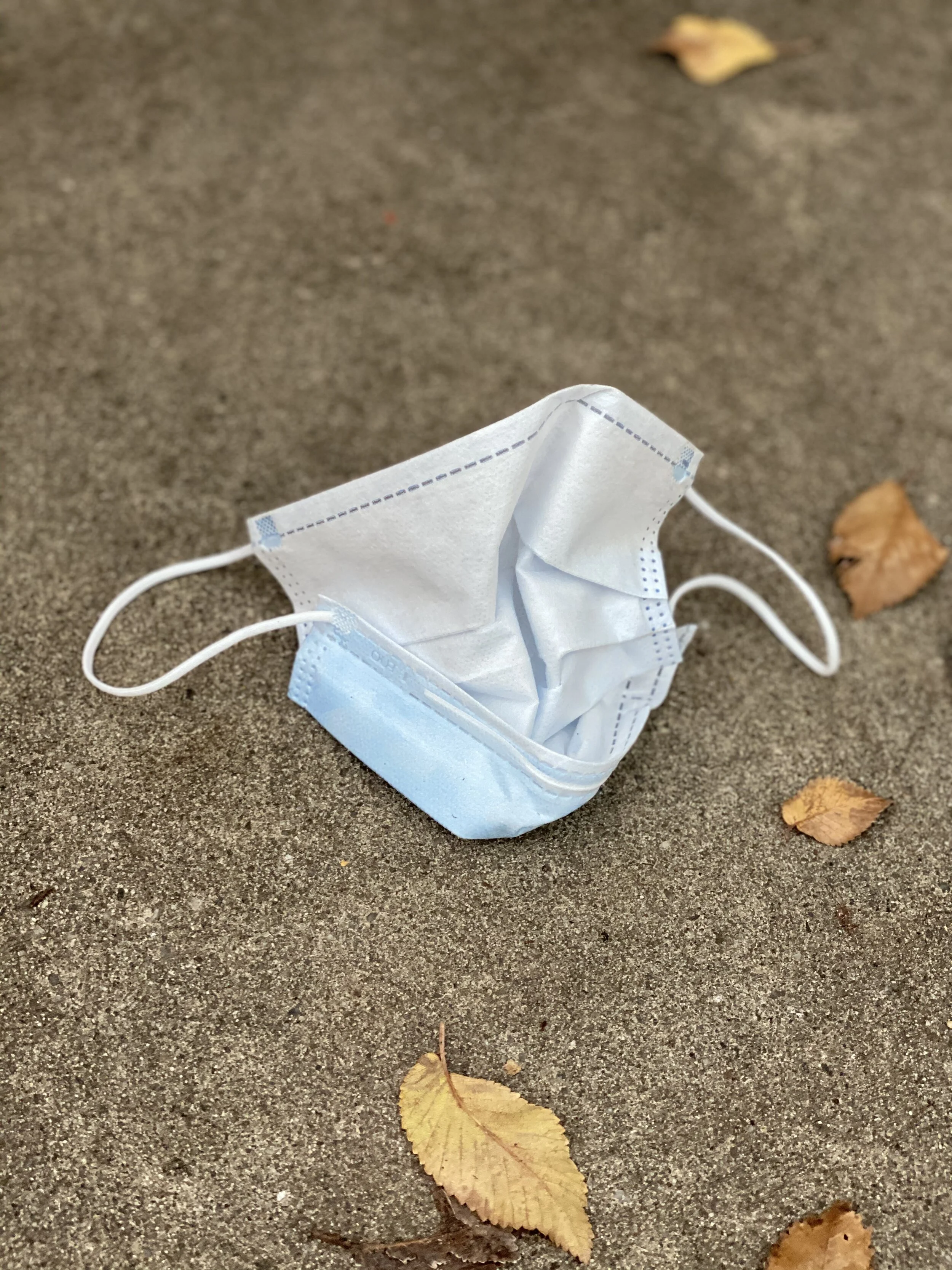 A discarded face mask litters the streets of Adelaide.