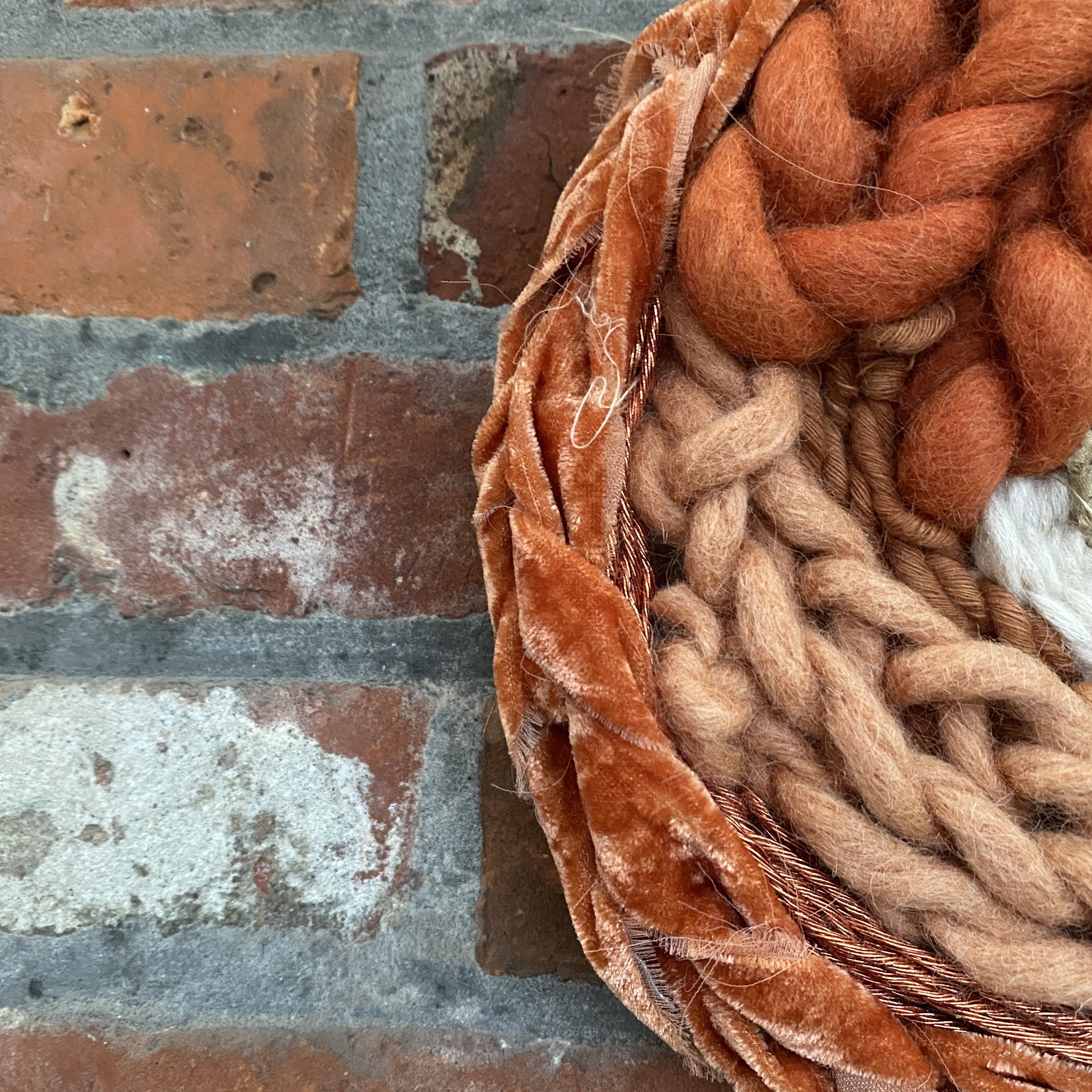 round burnt rust circular weaving detail.jpg