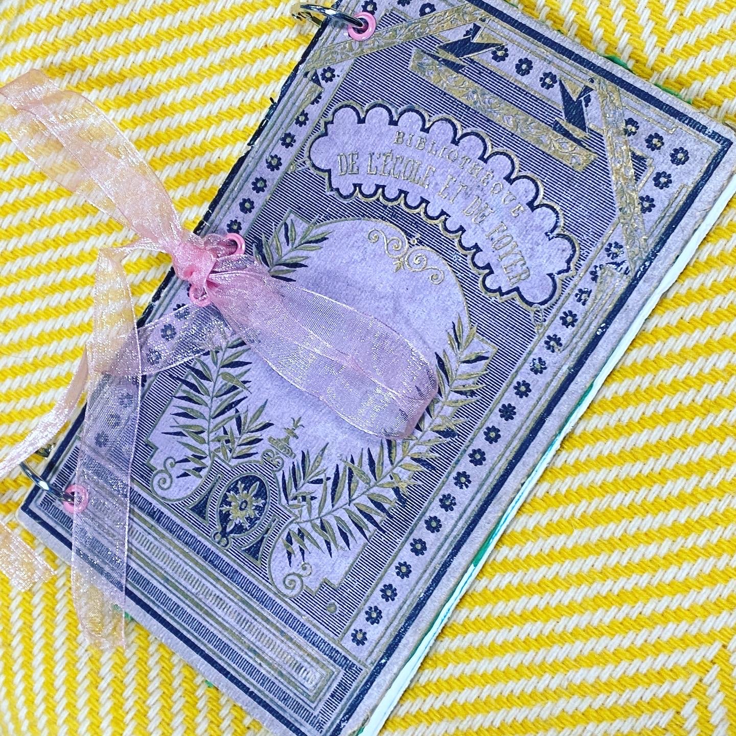 vintage lavendar book cover on a handmade art journal.jpg