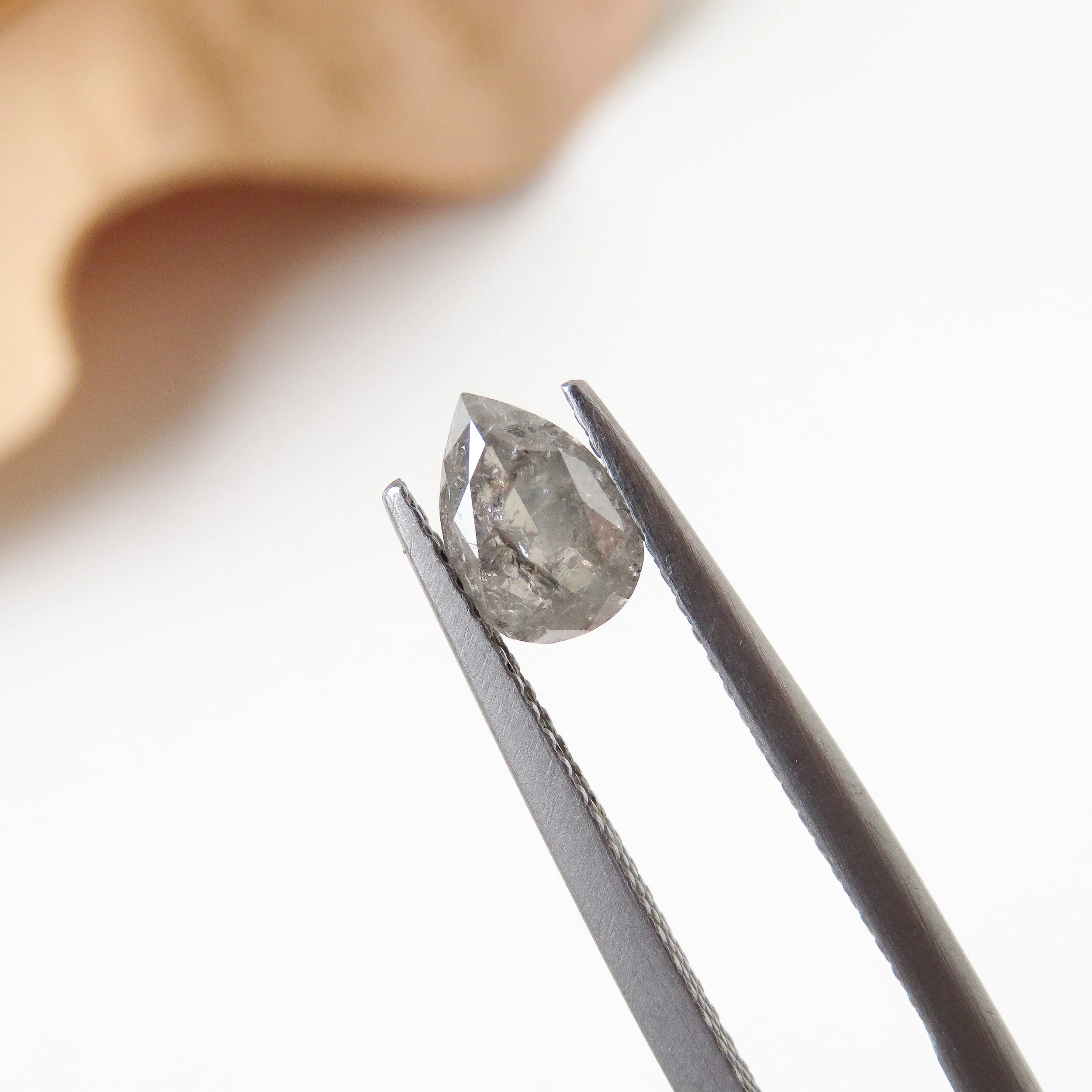 brilliant cut pear shaped salt and pepper diamond