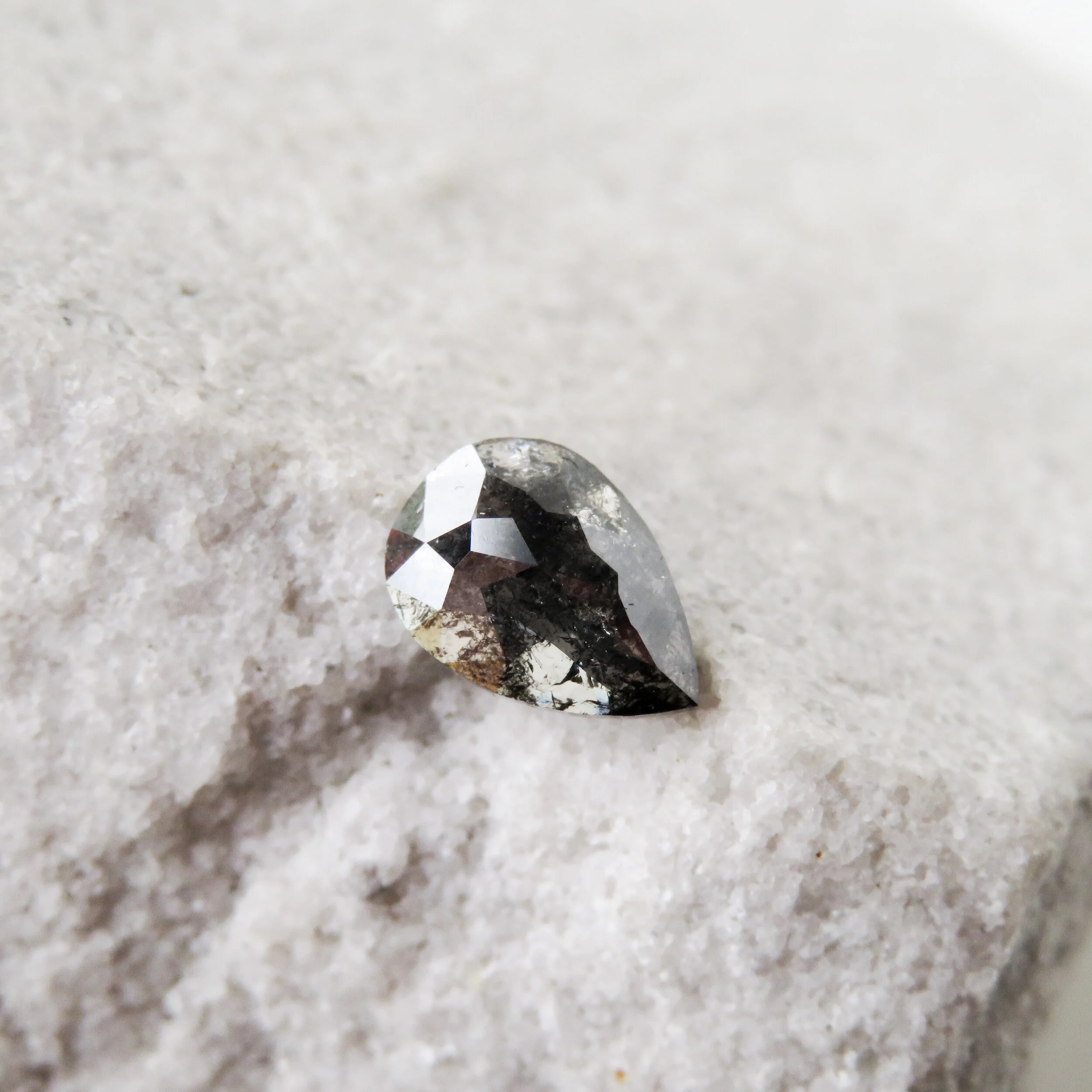 dark grey unique pear shaped brilliant cut diamond