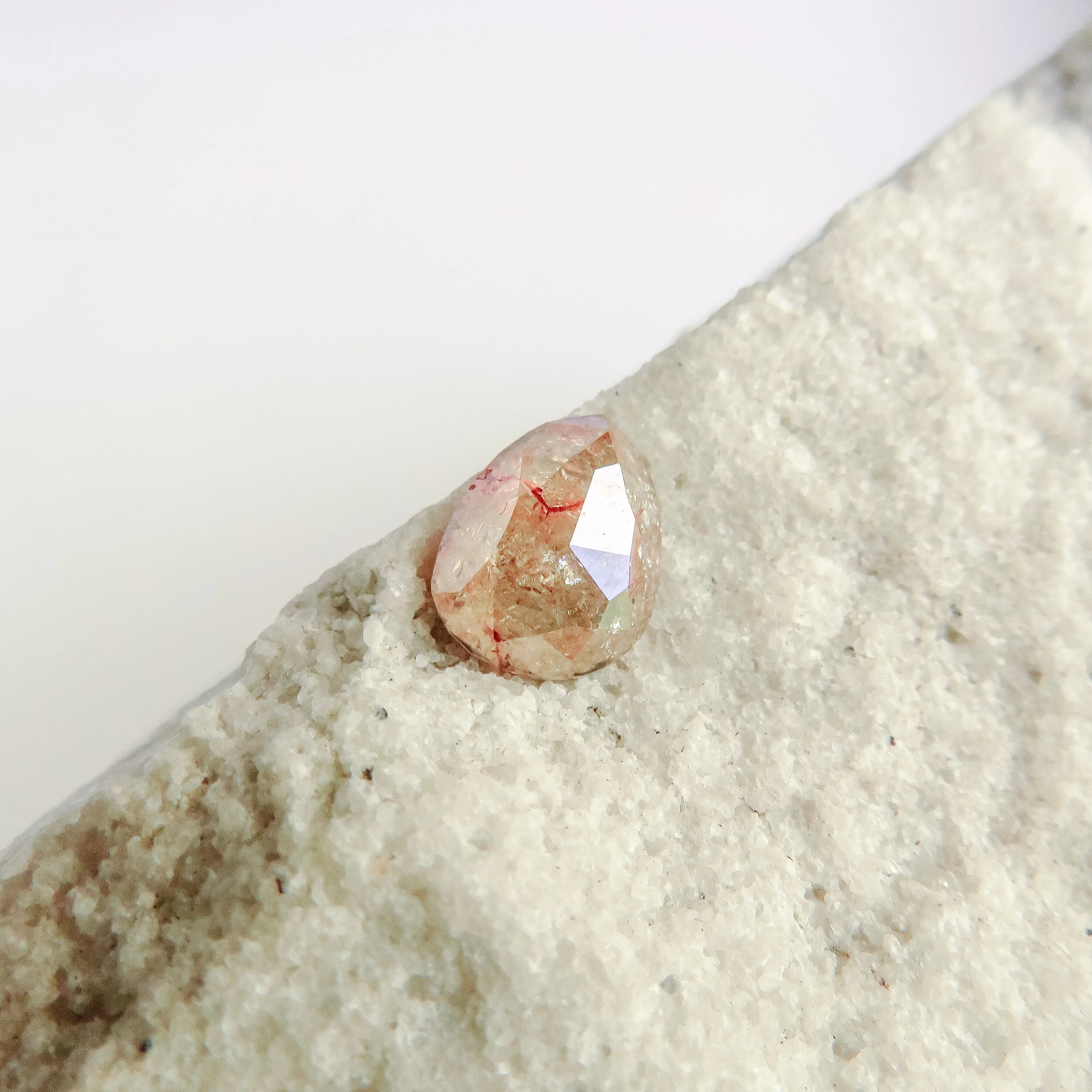 reddish yellow rose cut pear shape alternative diamond
