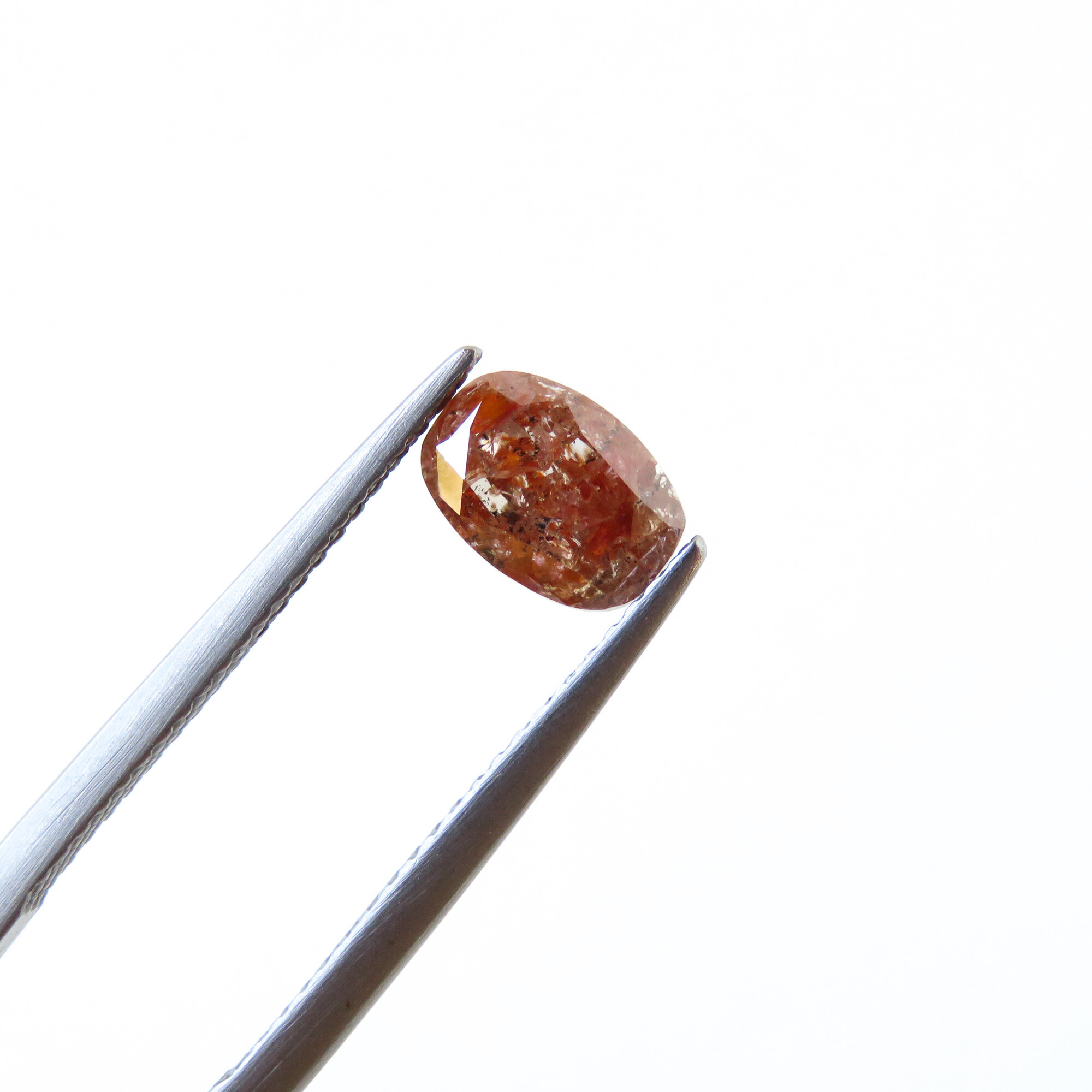 reddish brown oval cut diamond