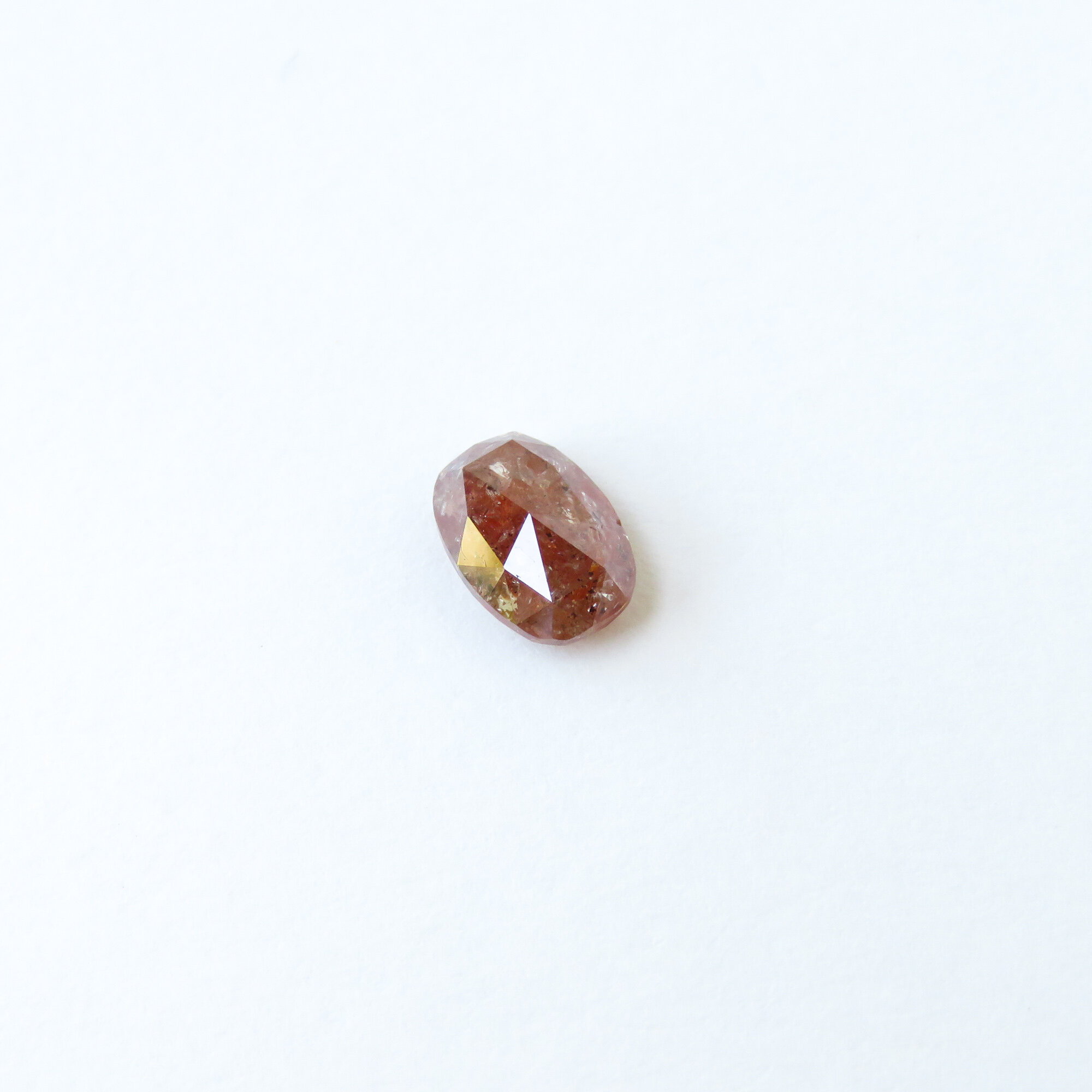 reddish brown oval mixed cut diamond