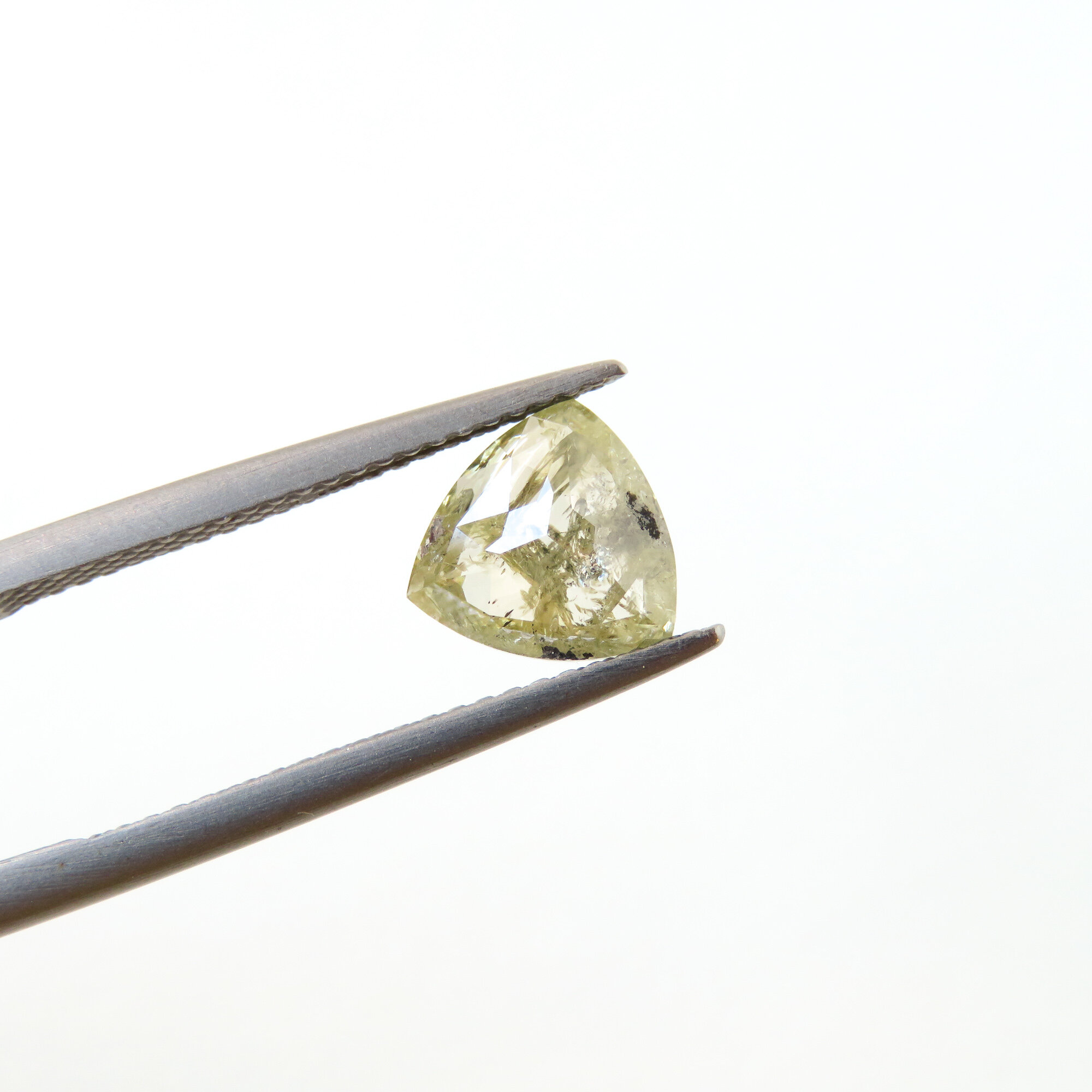 slight blackish yellow trillion diamond shape