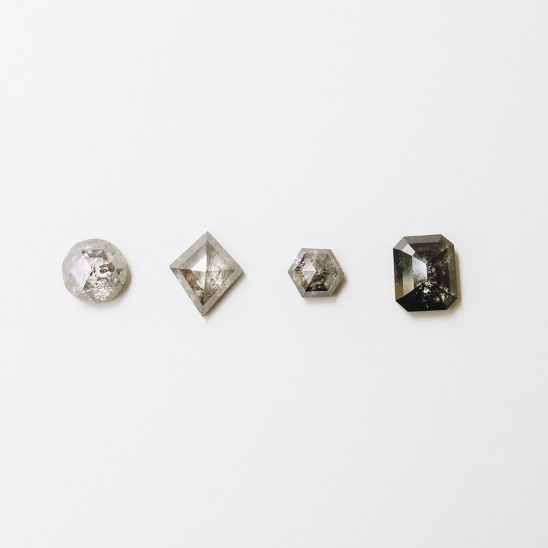 different diamond cuts, round, kite, hexagon and emerald cut salt and pepper diamonds
