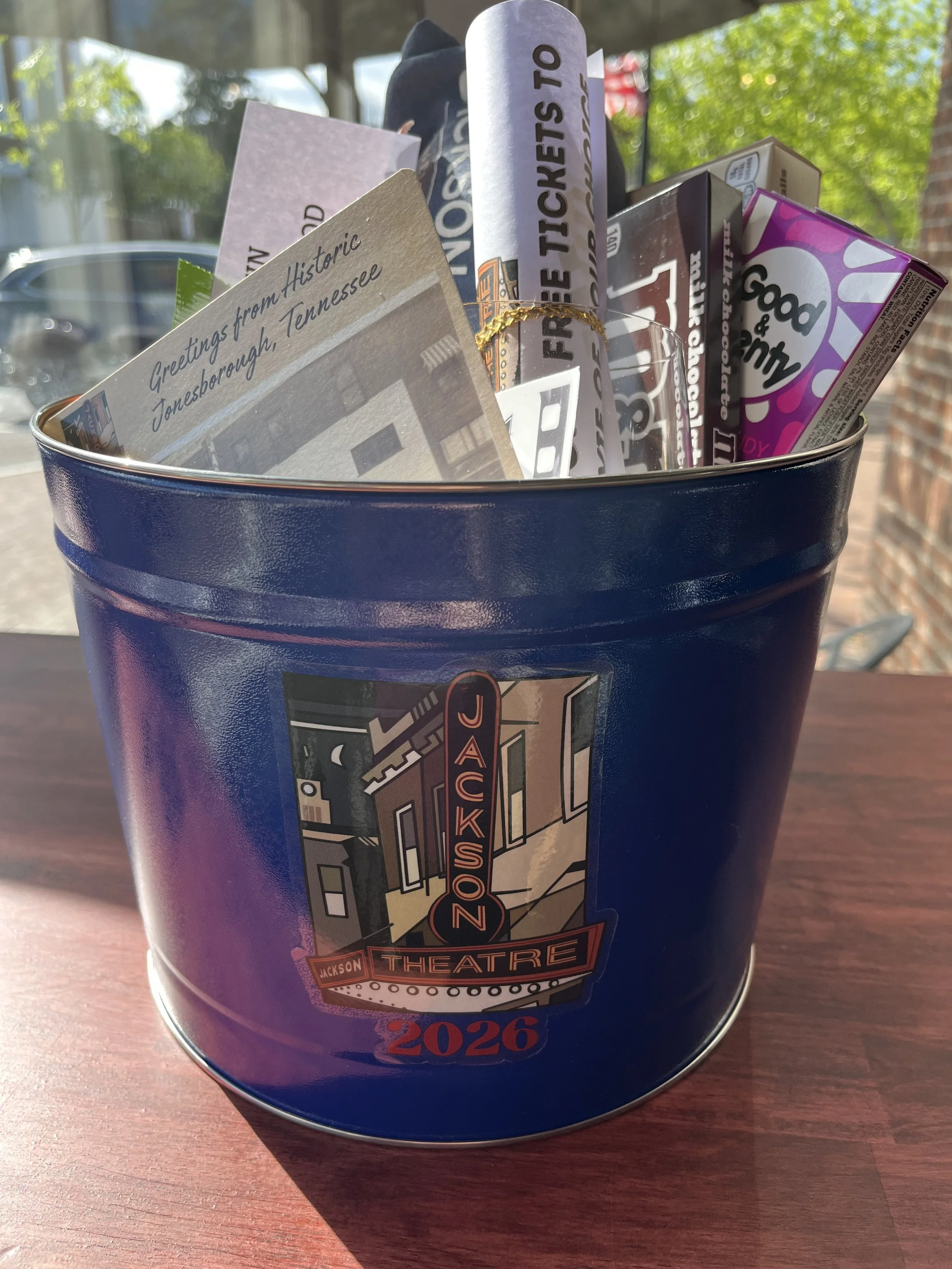 Jackson Theatre bundle - voucher for 4 tickets, popcorn tin, theatre candy, and Jackson Theatre merchandise - donated by the Jackson Theatre