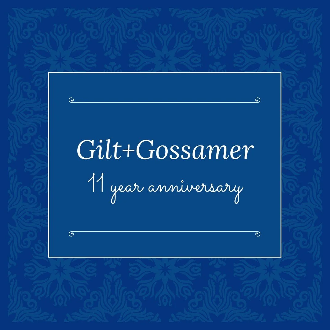 Blue anniversary card with decorative patterns, text reads 'Gilt+Gossamer, 11 year anniversary'.
