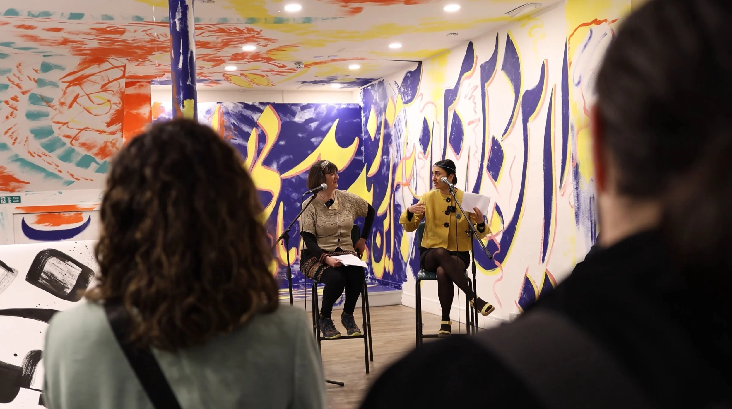 View from behind guests as they listen to Sahar Saki being interviewed by Mab Jones.jpeg