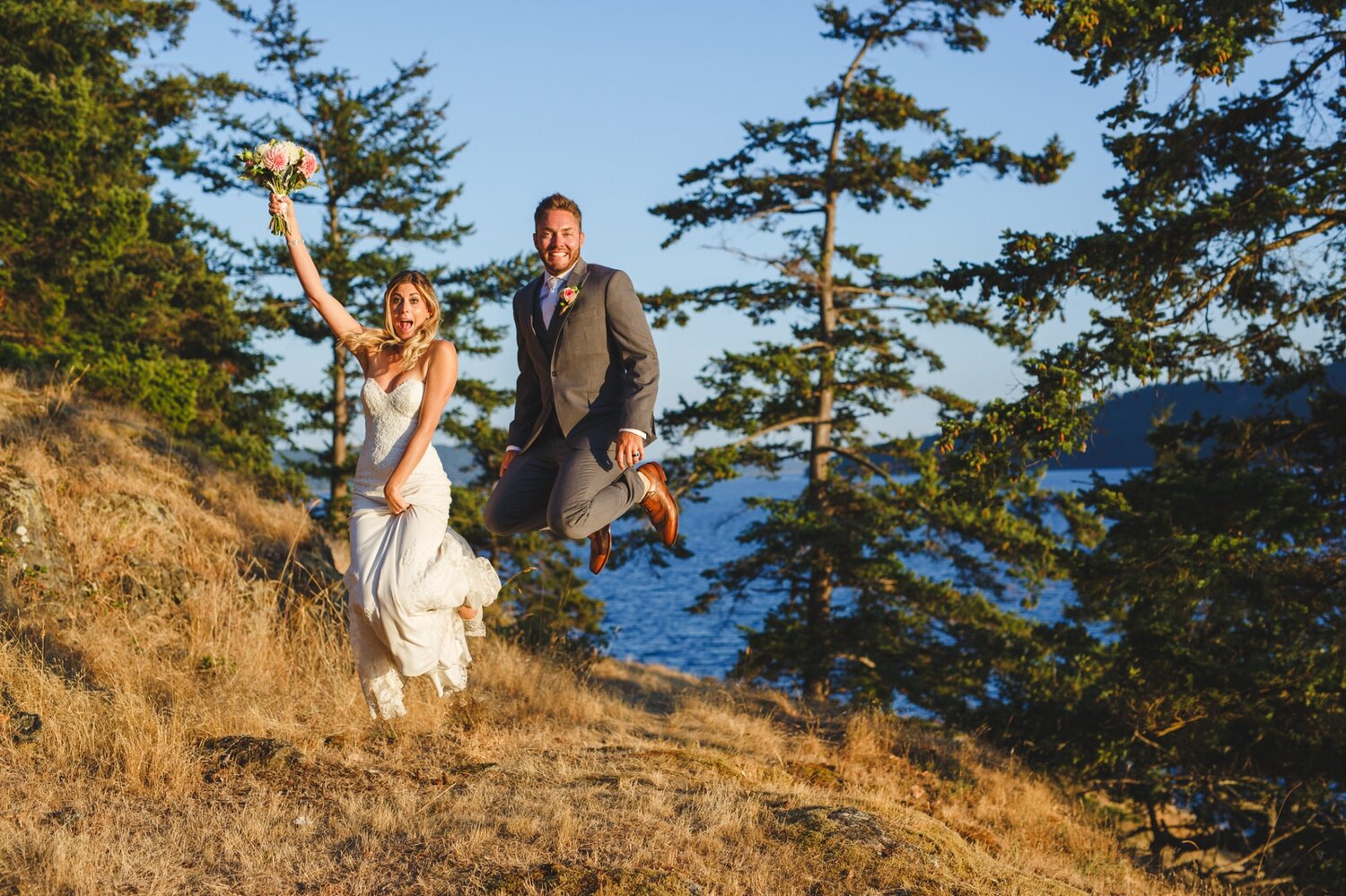 Bride and Groom Jumping at Sunset by Satya Curcio Photography