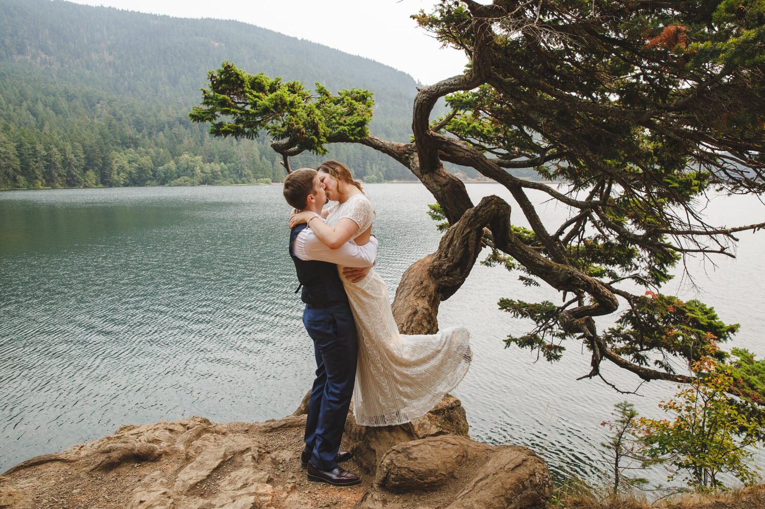  bridal portraits at Moran State Park  overlooking water with twisted trees 