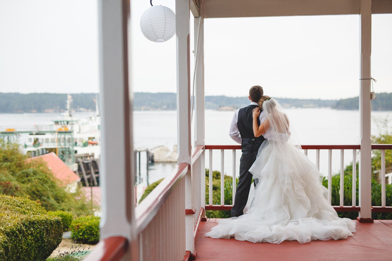 Bride and Groom at ferry landing by Satya Curcio Photography