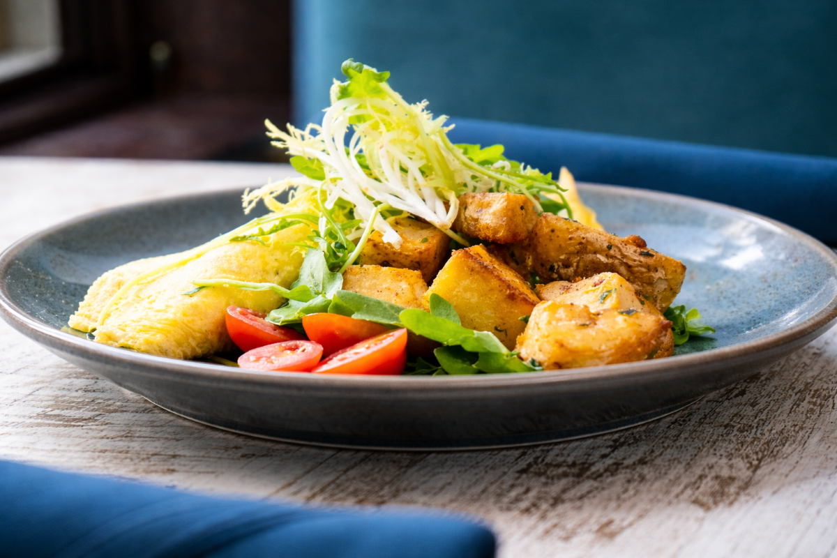 Brunch plate with roasted potatoes and omelette.png