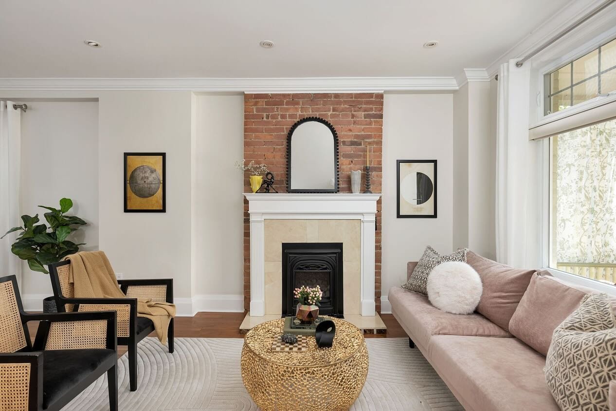 We loved staging this charming house in East York, from its cute front porch, to the warmth that it oozed and the red brick fireplace. We kept it chic with a soft pink velvet couch and gold coffee table, a touch of boho with the rattan accent chairs 