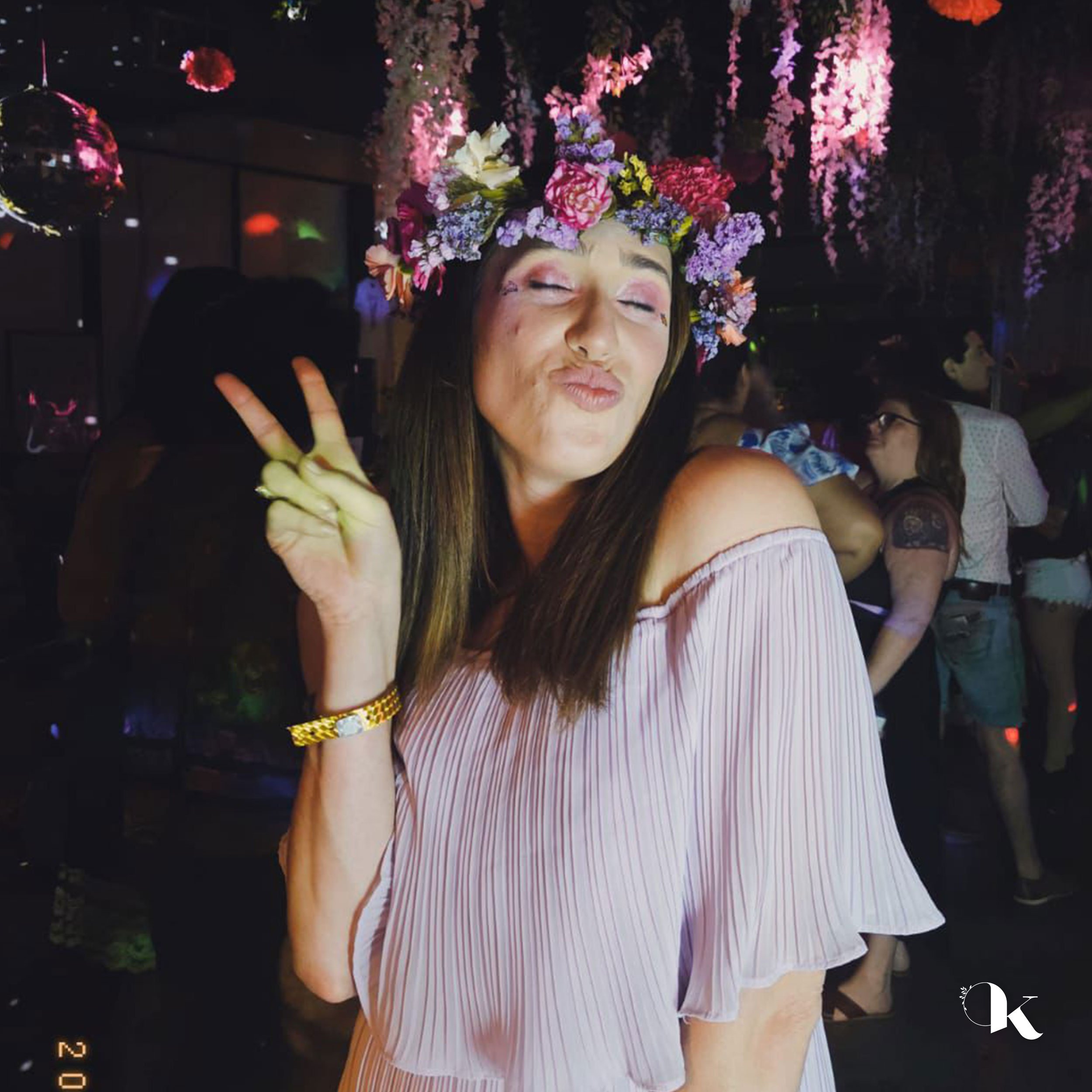 Handmade Pride flower crown featuring carnations and seasonal blooms for festivals and celebrations.